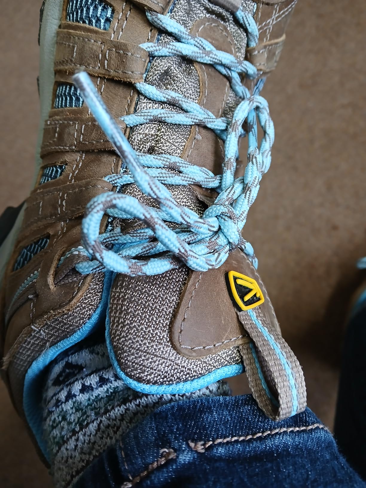 KEEN Voyageur showing water-resistant leather upper and performance mesh breathability panels