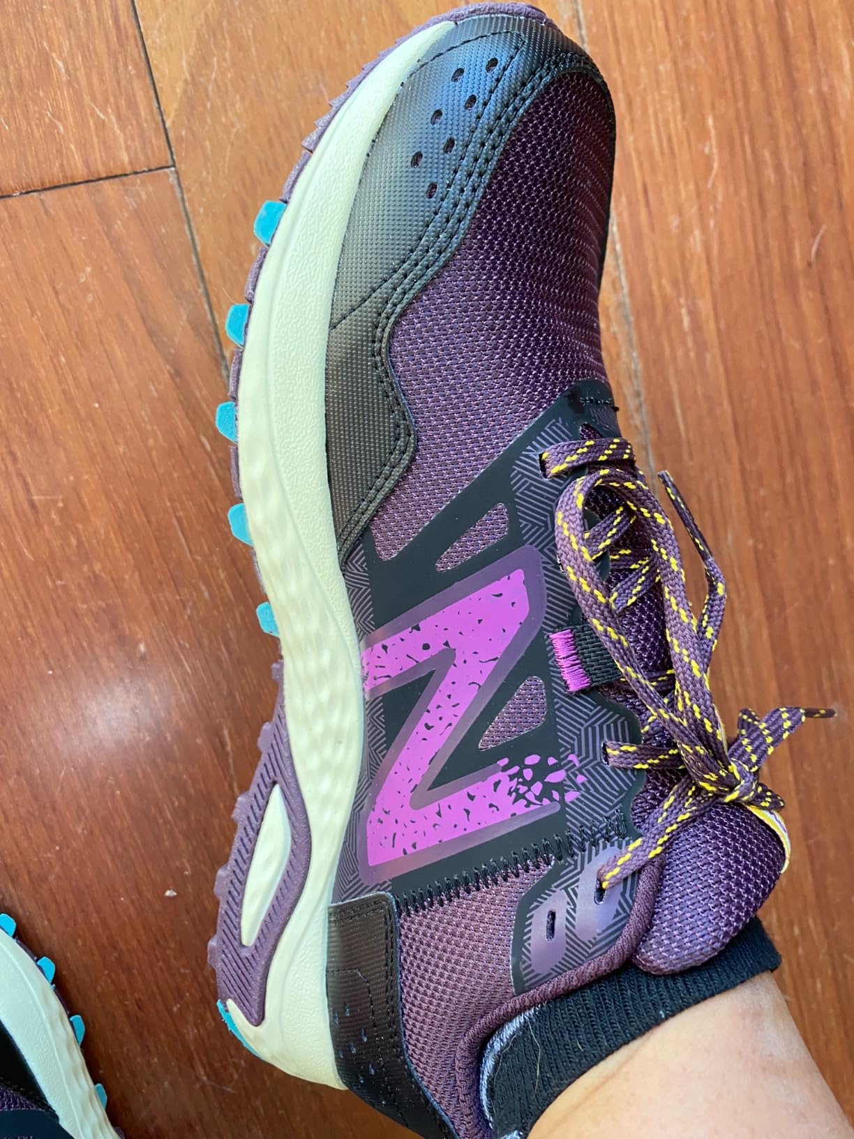 New Balance 410 V8 showing versatile styling appropriate for both trail and casual urban settings