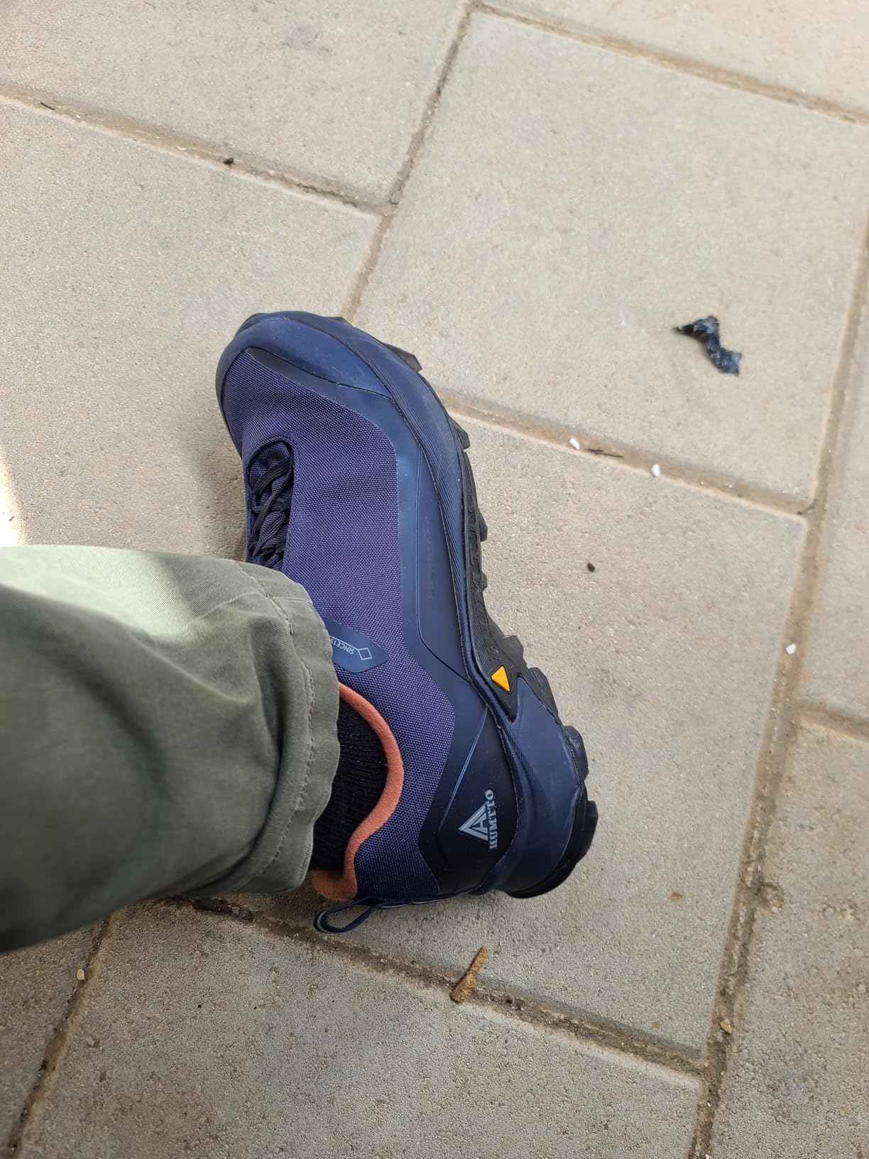 HUMTTO Men's All-Terrain Waterproof Hiking Shoes in navy blue showing rugged construction and aggressive tread pattern