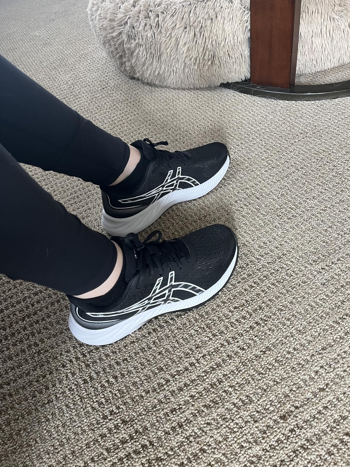 Side profile of ASICS Gel-Excite 9 showing midsole cushioning stack and heel-to-toe geometry