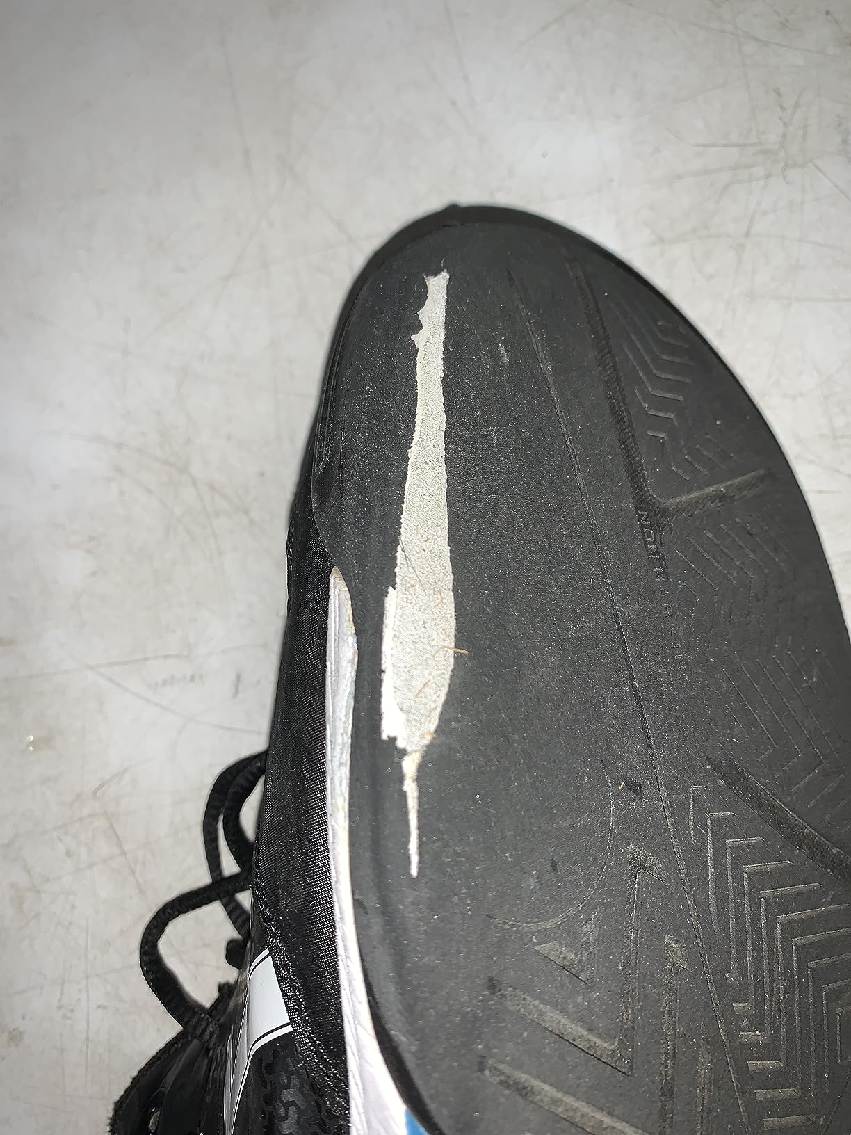 Multiple ASICS Gel-Dedicate 7 shoes showing various wear patterns after different playing conditions