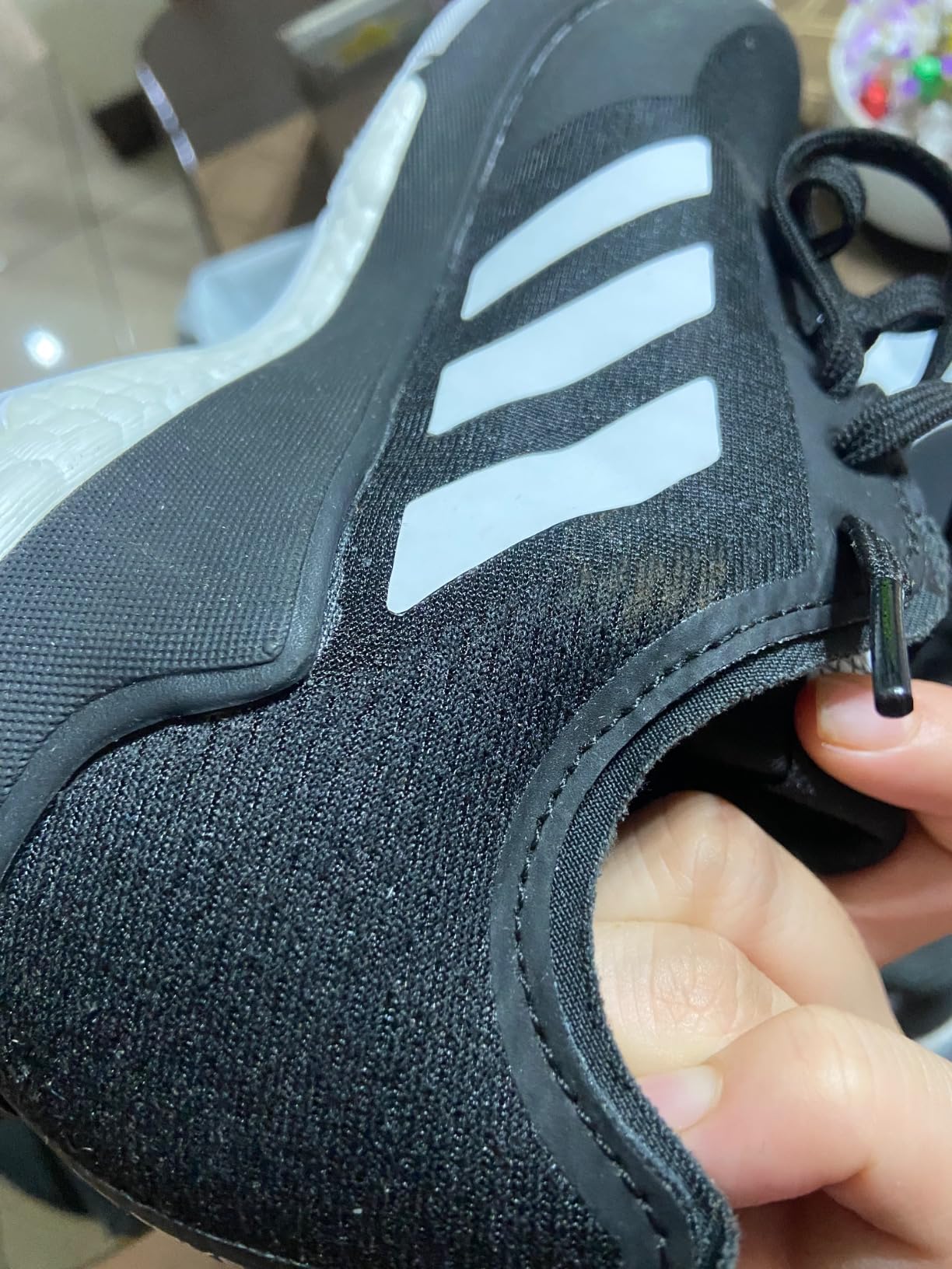 Adidas Crazyflight volleyball shoes close-up of mesh upper construction and three stripes design detail