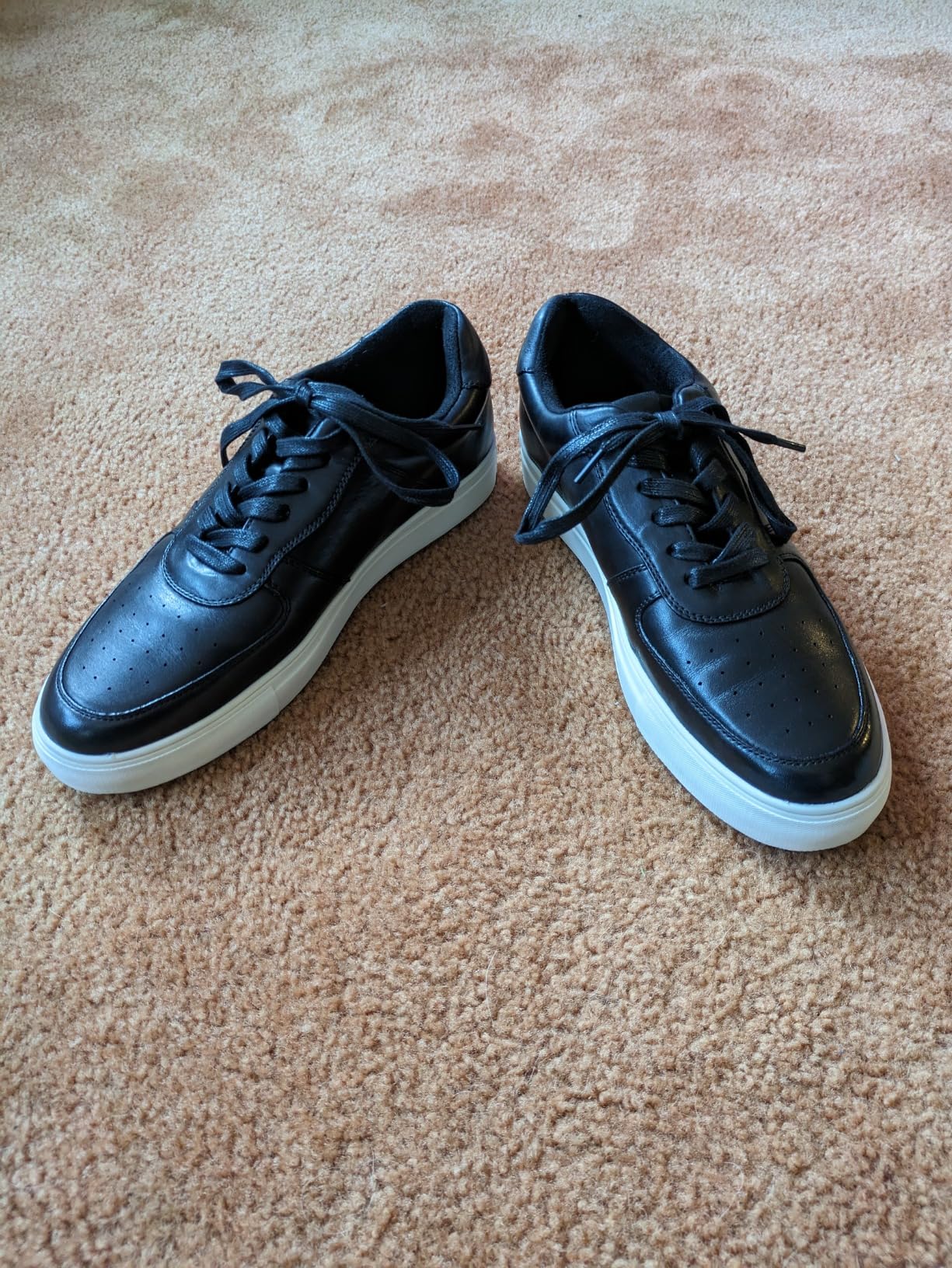 Side profile of Jousen men's dress sneaker showing sleek silhouette and oxford-inspired lacing with contrasting white midsole