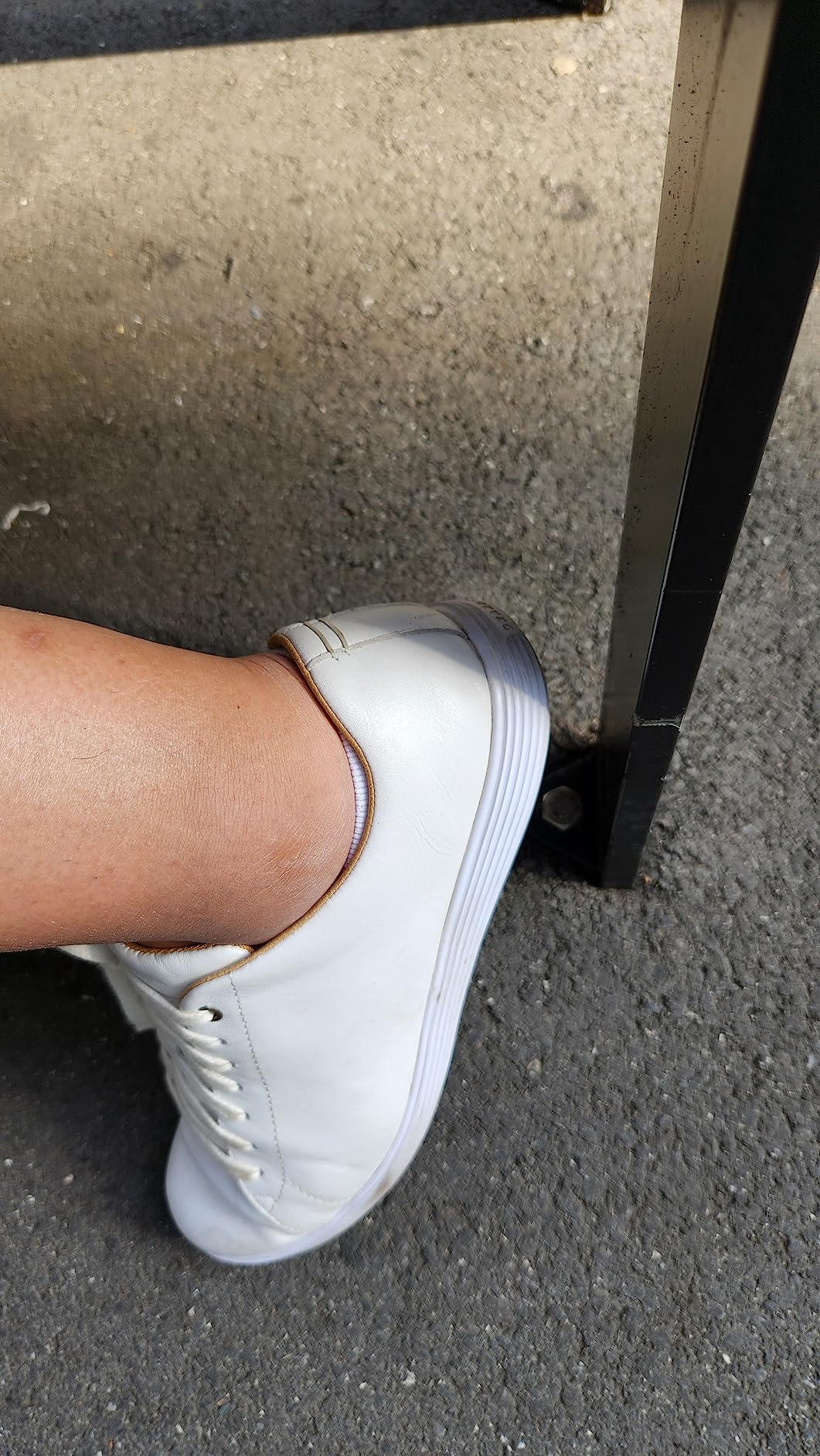 Cole Haan Grand Crosscourt being worn showing real-world usage and slight wear patterns