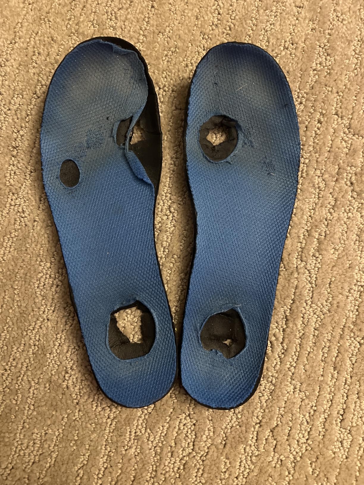 Merrell Trail Chaser insole showing visible deterioration including holes after approximately six weeks of daily school wear