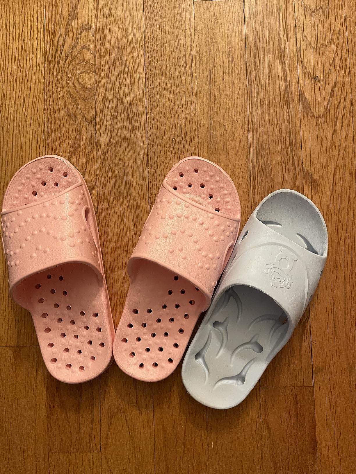 Bottom view of shevalues shower shoes showing textured outsole drain hole pattern for traction and drainage