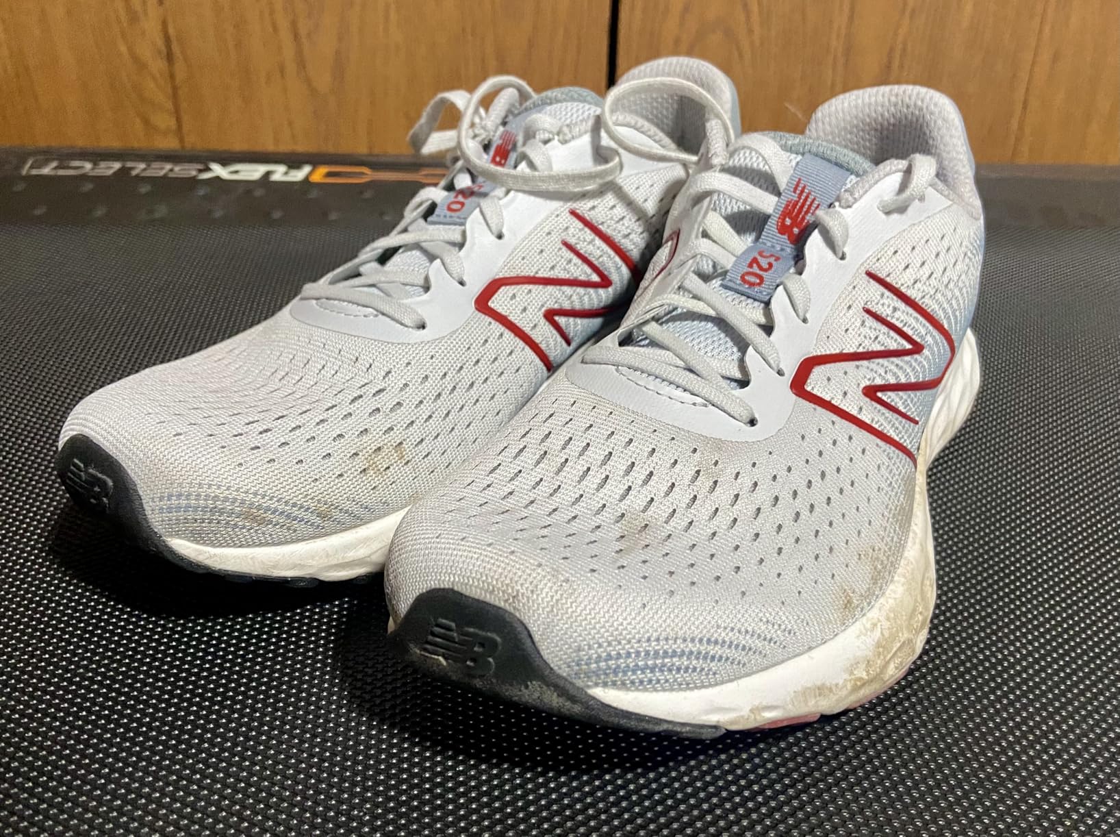 New Balance 520 V8 being worn on running track during speed workout testing session in summer conditions