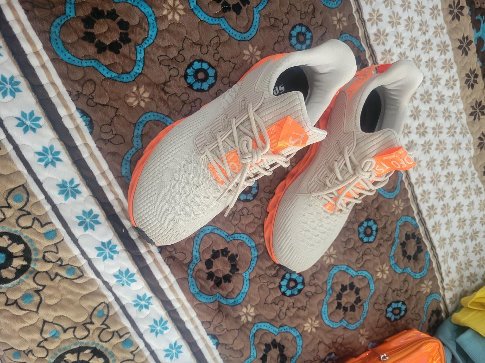 Side profile of TSIODFO sneakers showing athletic silhouette and slip-on design for walking