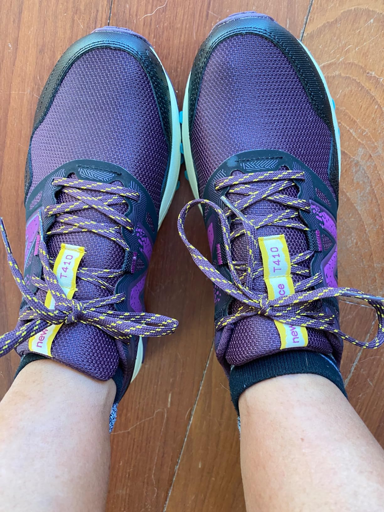 Detailed view of New Balance 410 V8 AT Tread outsole pattern showing tread durability and grip design