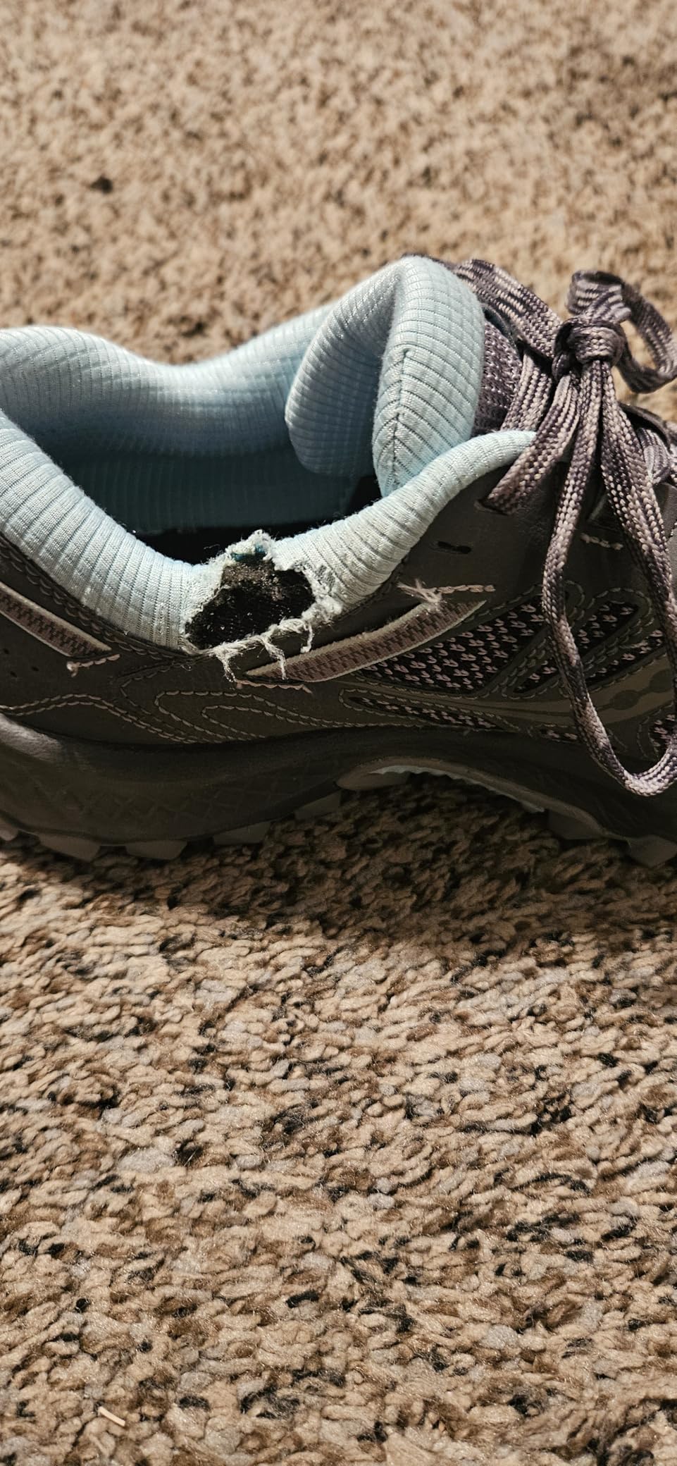 Multiple customer photos showing durability issues with Saucony TR13 trail shoes at ankle area