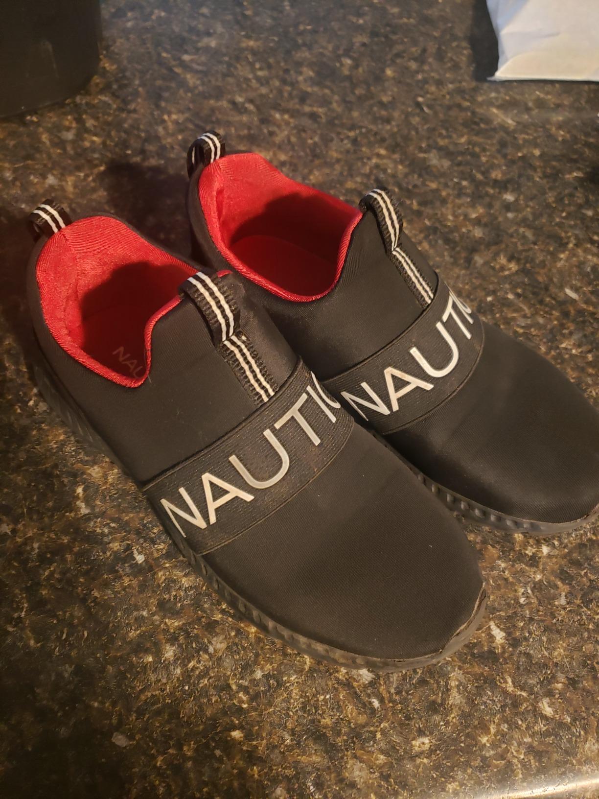 Nautica Kids Boys slip-on sneakers showing black and red colorway with fabric upper and rubber sole