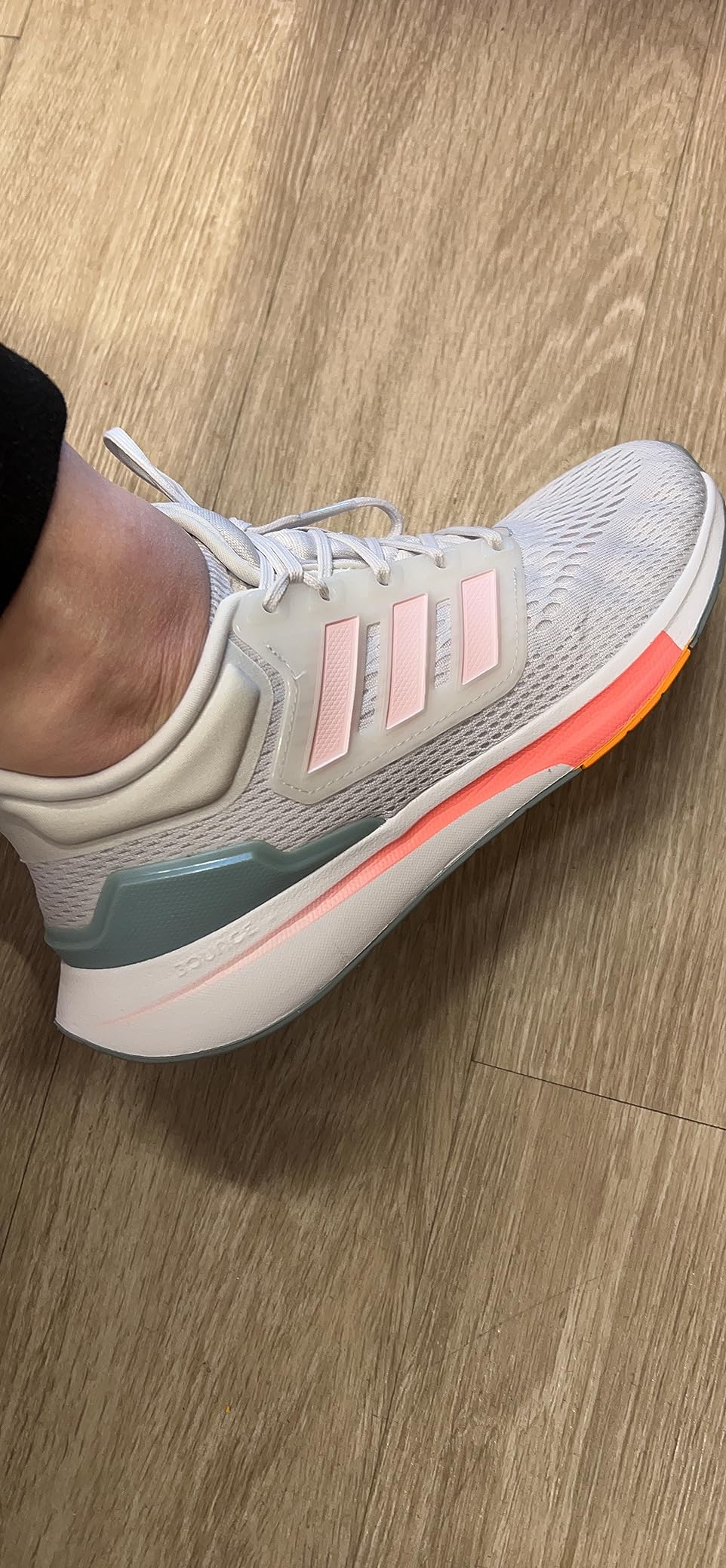 Close-up of adidas Eq21 engineered mesh upper showing breathable weave pattern and Geofit padded ankle collar construction