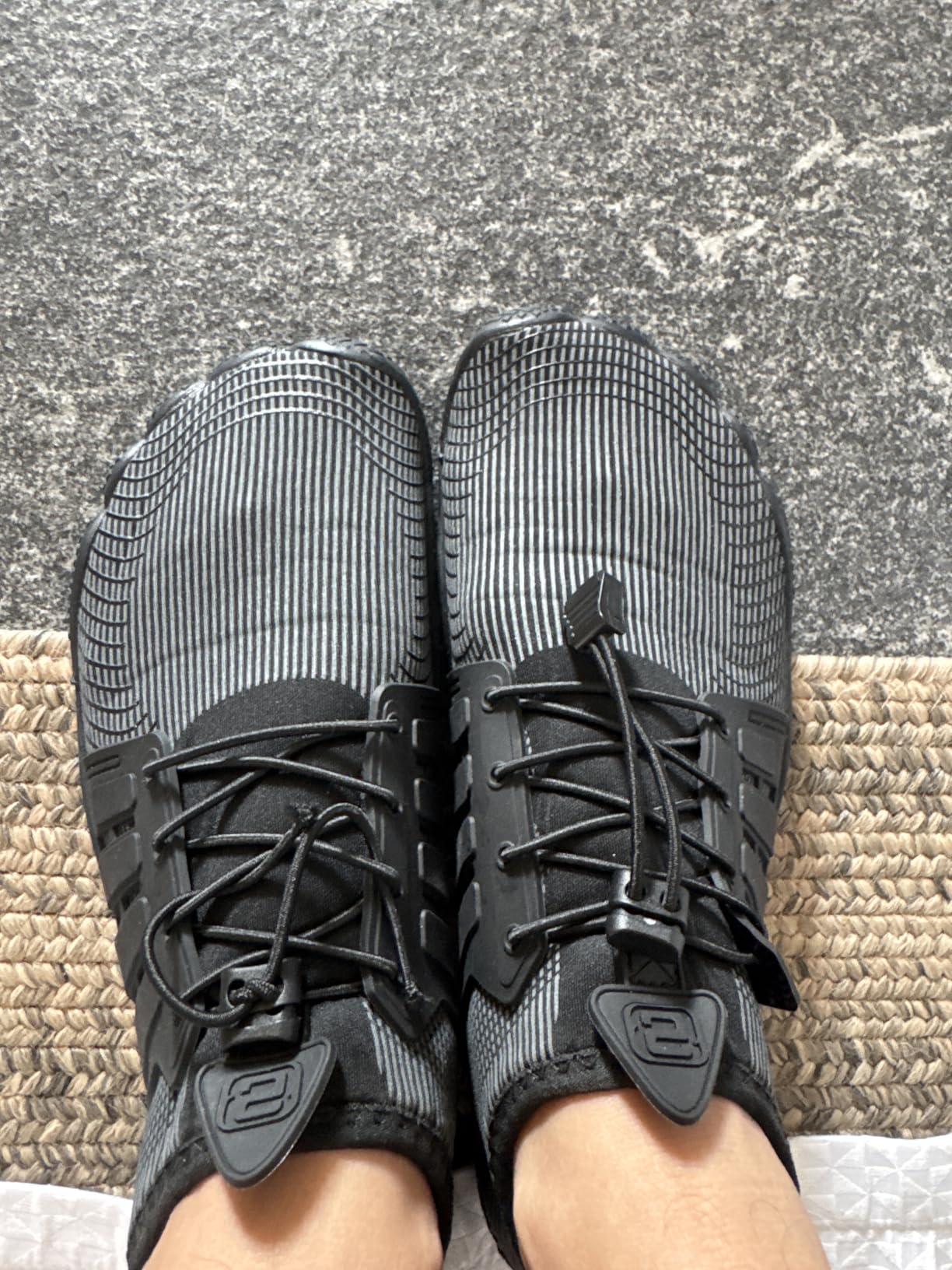 WateLves water shoes sole pattern showing drainage holes and non-slip rubber grip texture