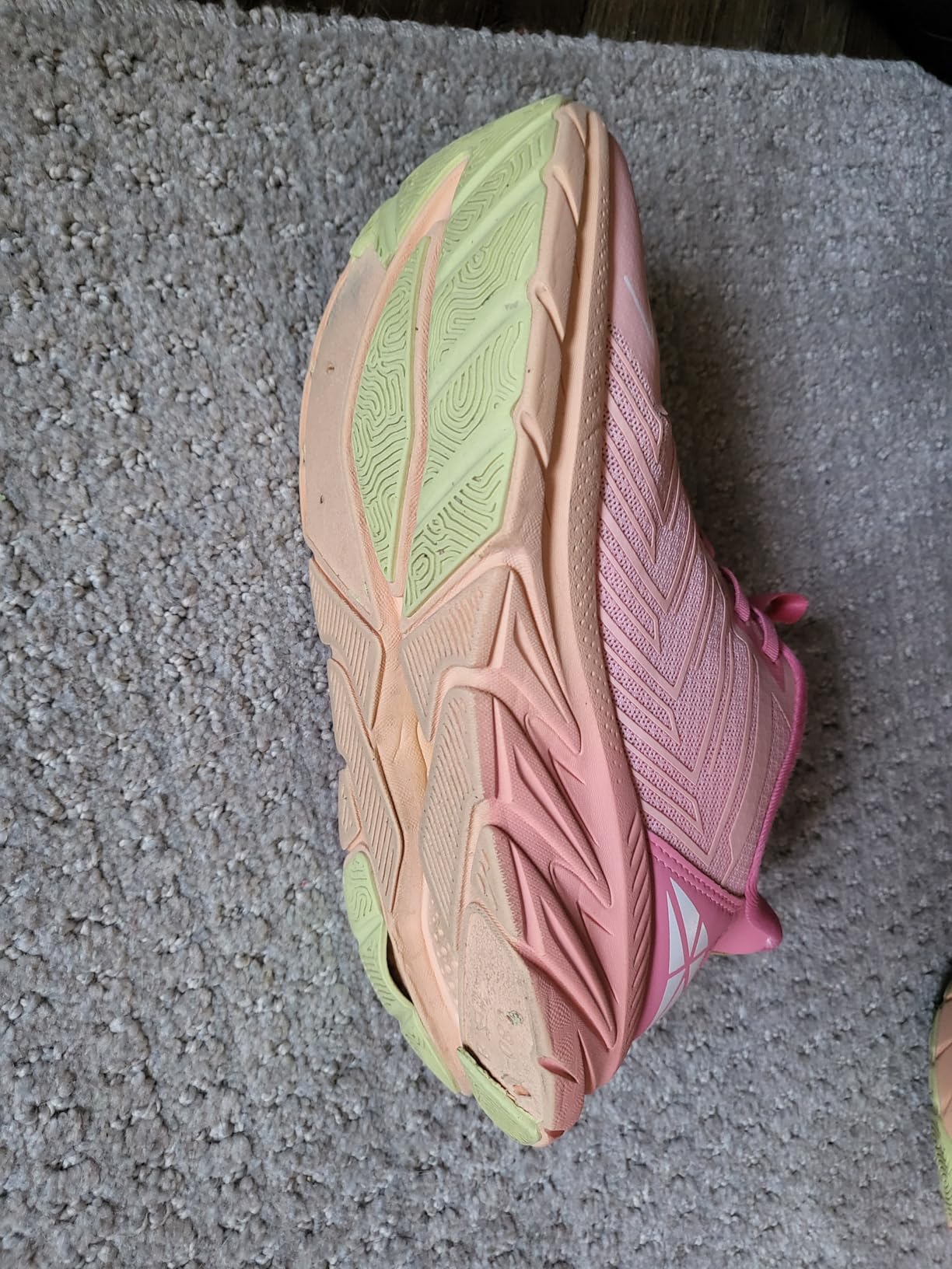 Women's slip on walking sneakers in pink colorway showing mesh upper and thick EVA sole