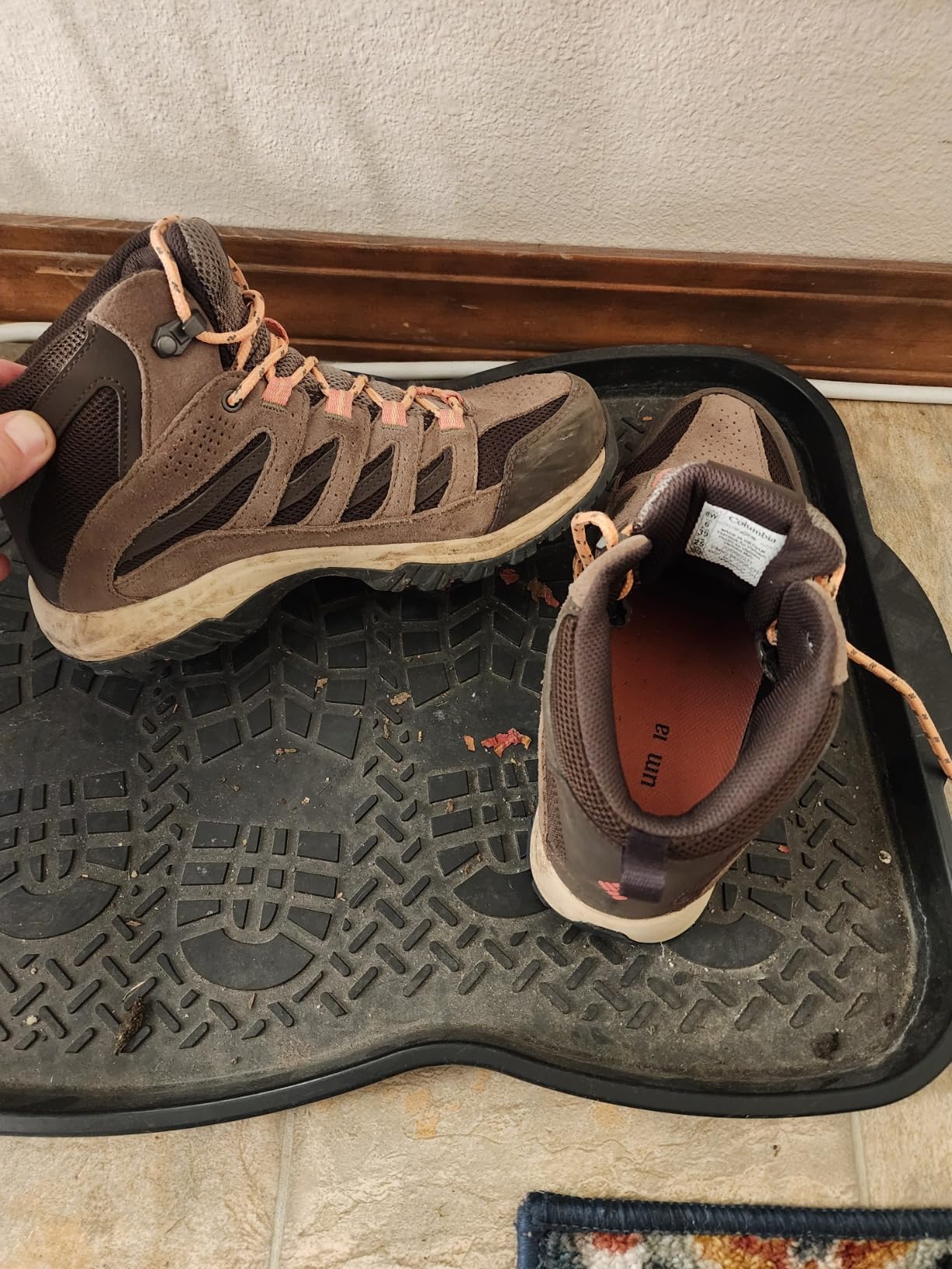 Columbia Women's Crestwood Mid Waterproof hiking boots in brown leather and mesh construction on trail