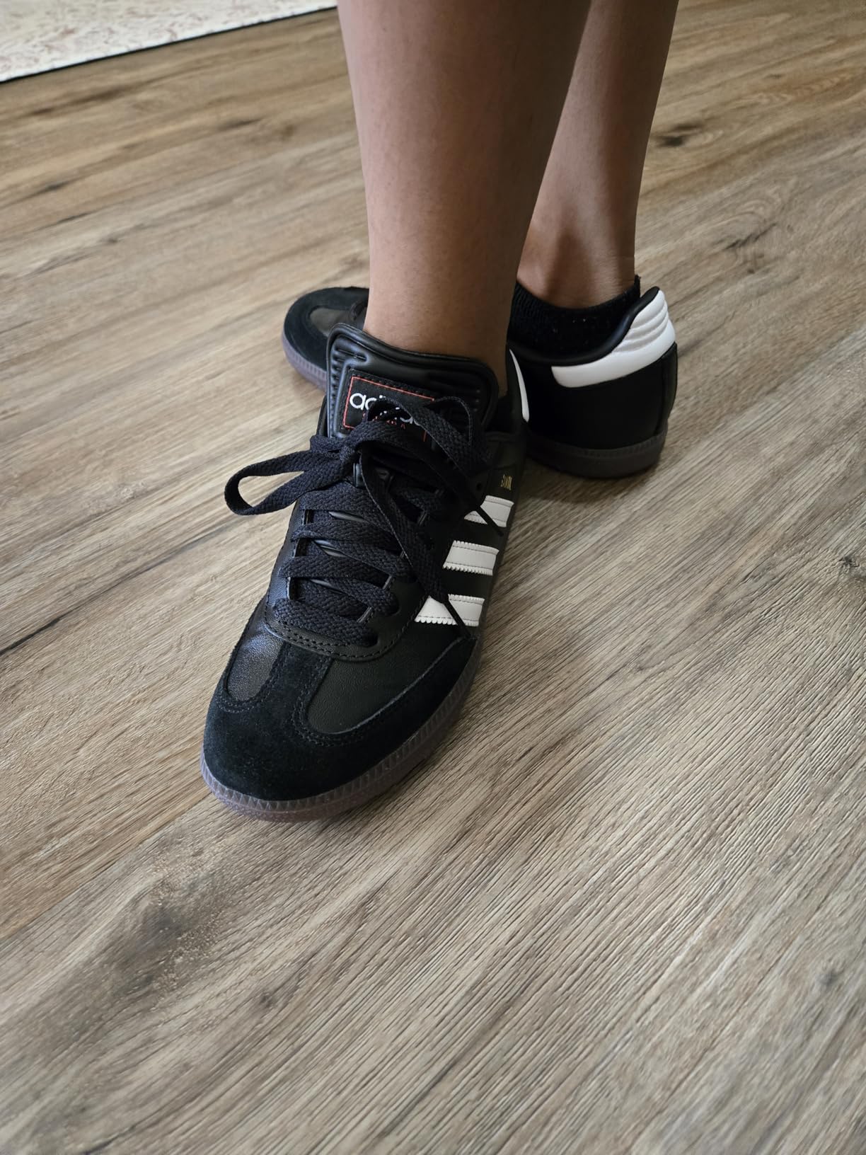 Adidas Samba kids construction details showing quality leather upper stitching and secure sole attachment