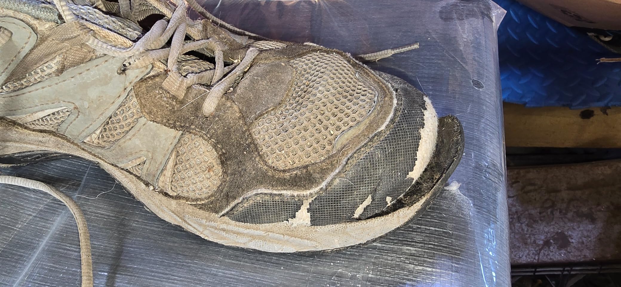 Close-up of Camel Crown hiking shoe construction showing nubuck leather reinforcement at toe cap and heel