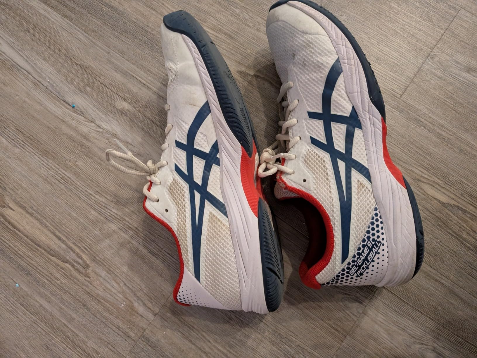 ASICS Gel-Game 9 side profile showing mesh upper construction and court shoe silhouette
