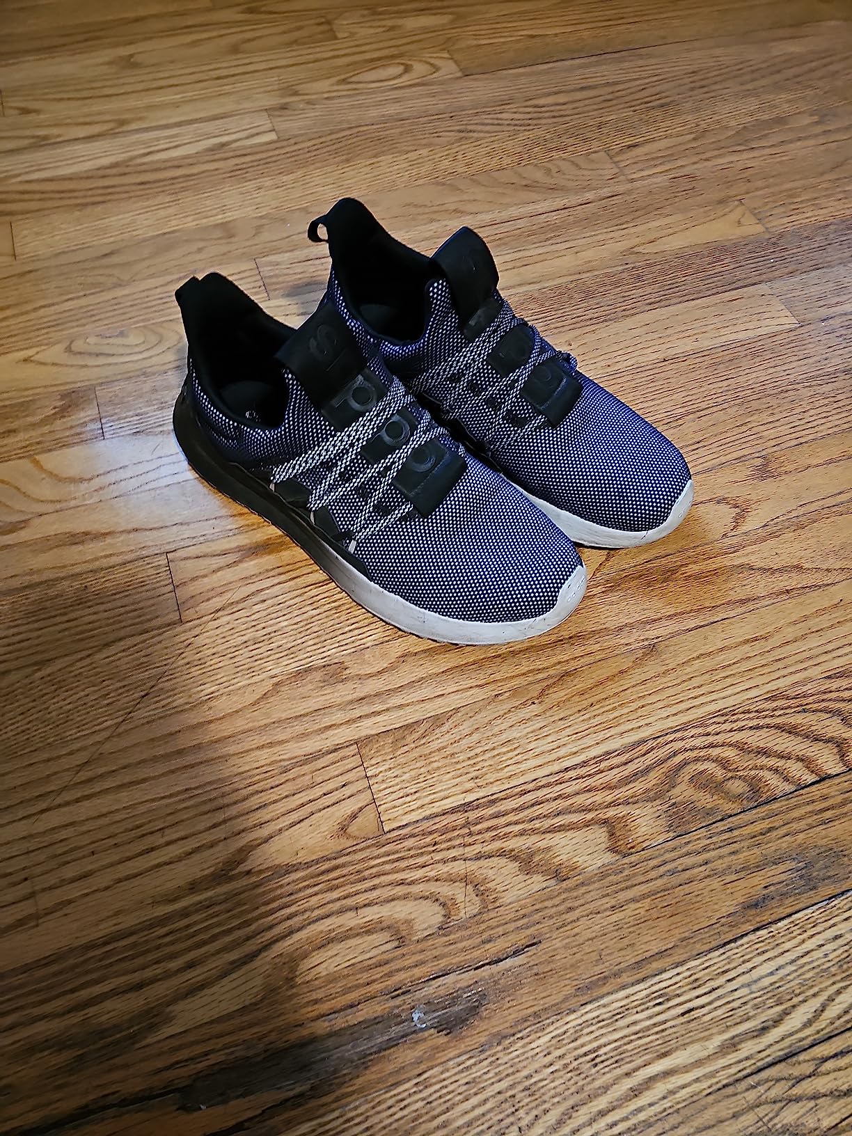 Sole tread pattern detail on the Adidas Lite Racer Adapt 5.0 showing rubber outsole construction