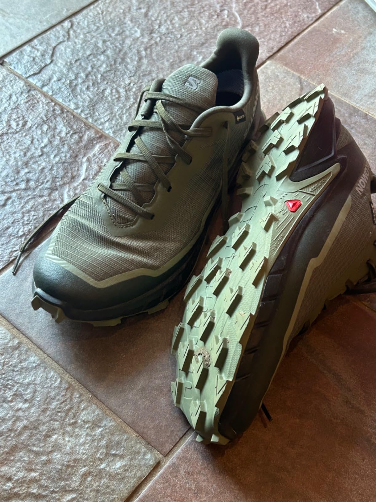 Salomon Men's Alphacross 5 Gore-Tex trail running shoes in olive green showing aggressive outsole lug pattern
