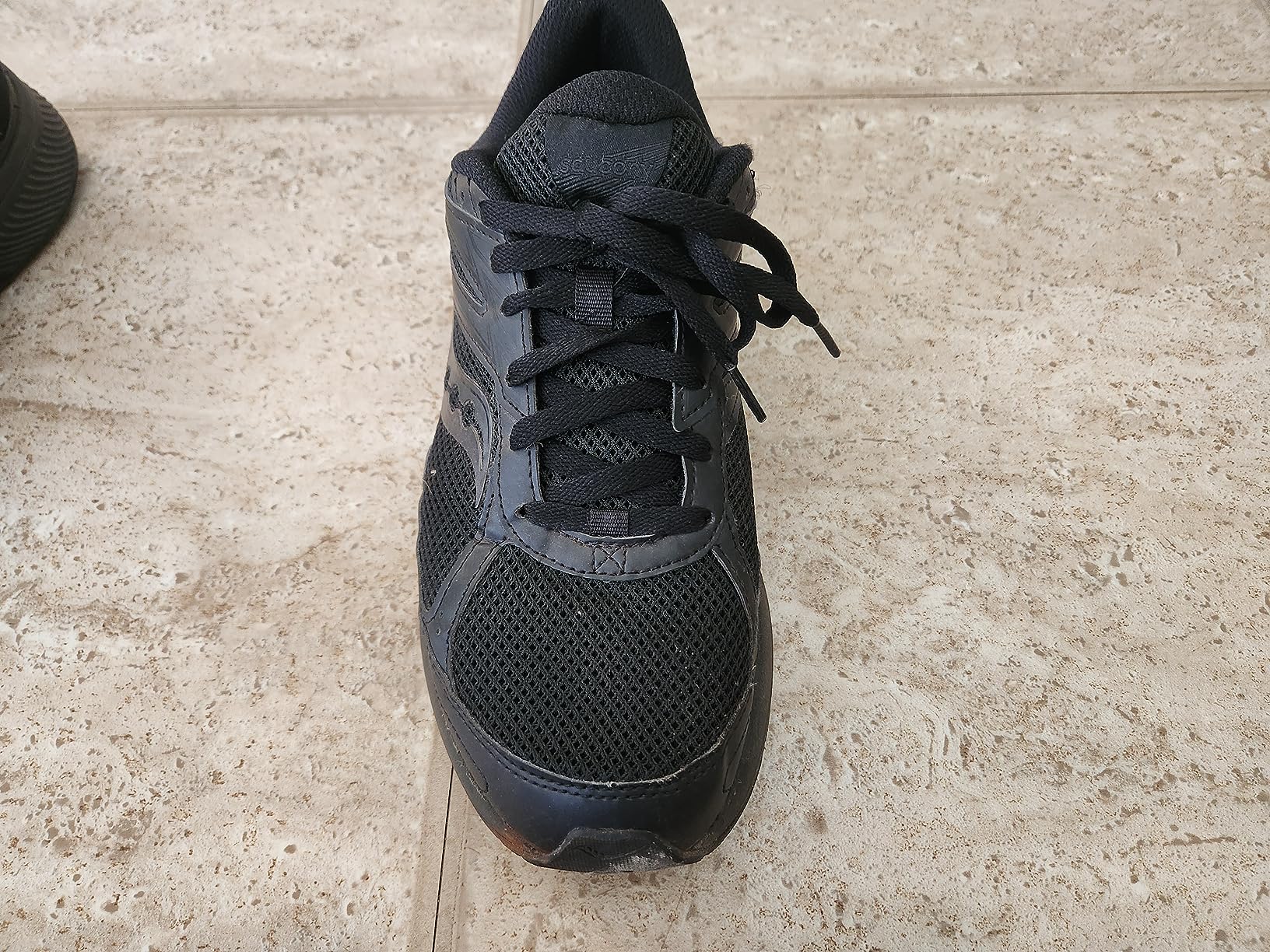 Saucony Cohesion 14 TR heel and ankle support detail showing protective overlays and collar padding