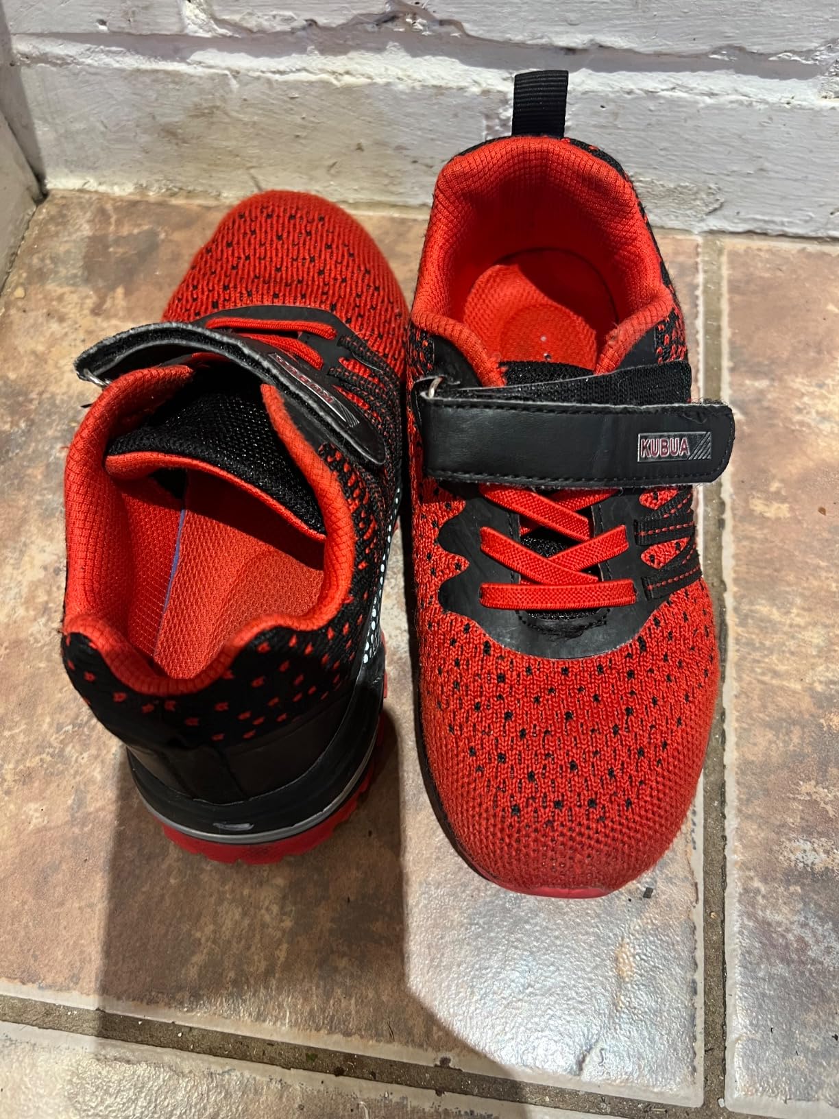 KUBUA Kids Sneakers in action during playground use showing outsole traction on varied surfaces