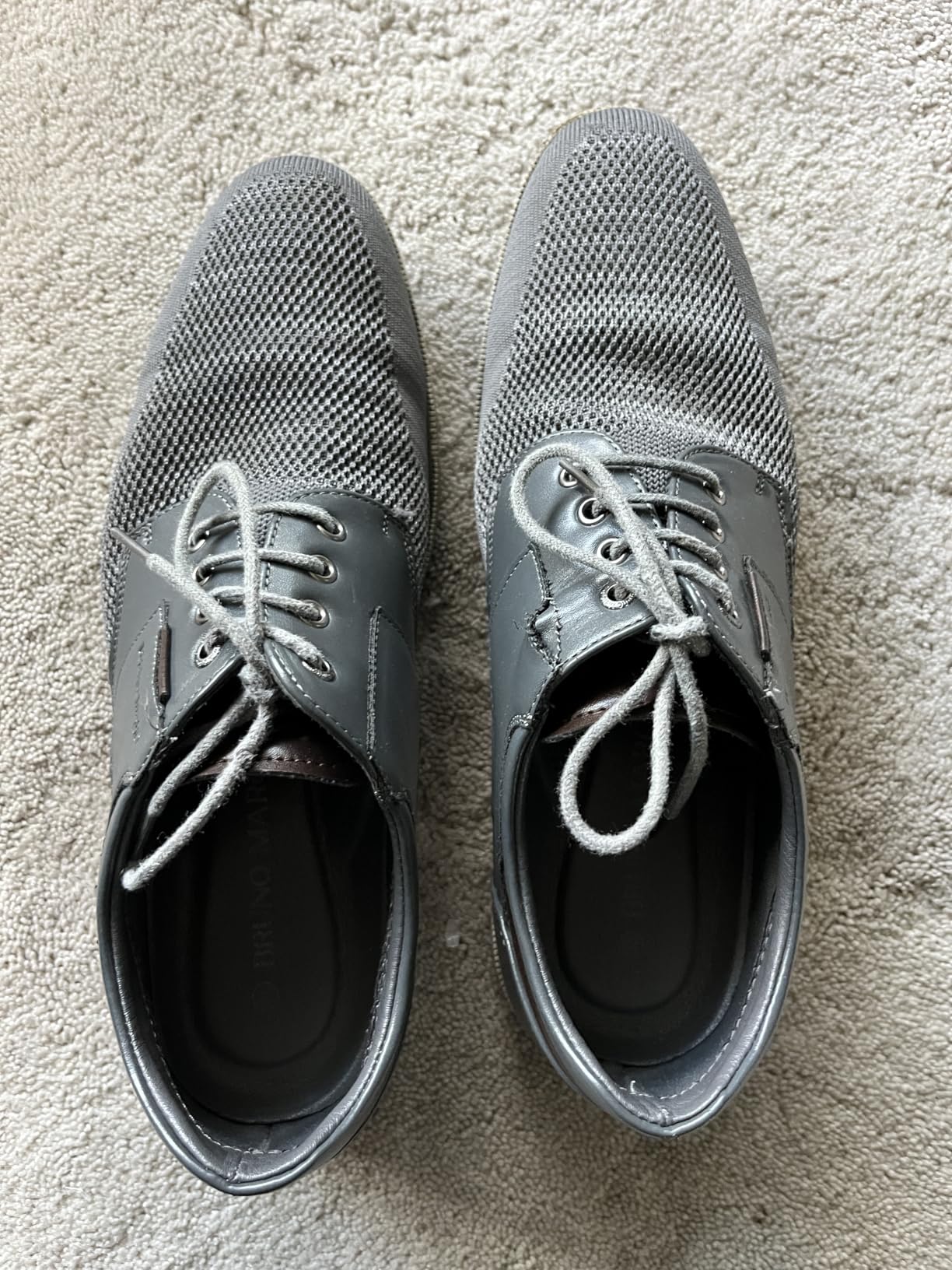 Customer photo showing Bruno Marc dress shoes being worn with professional attire after regular use