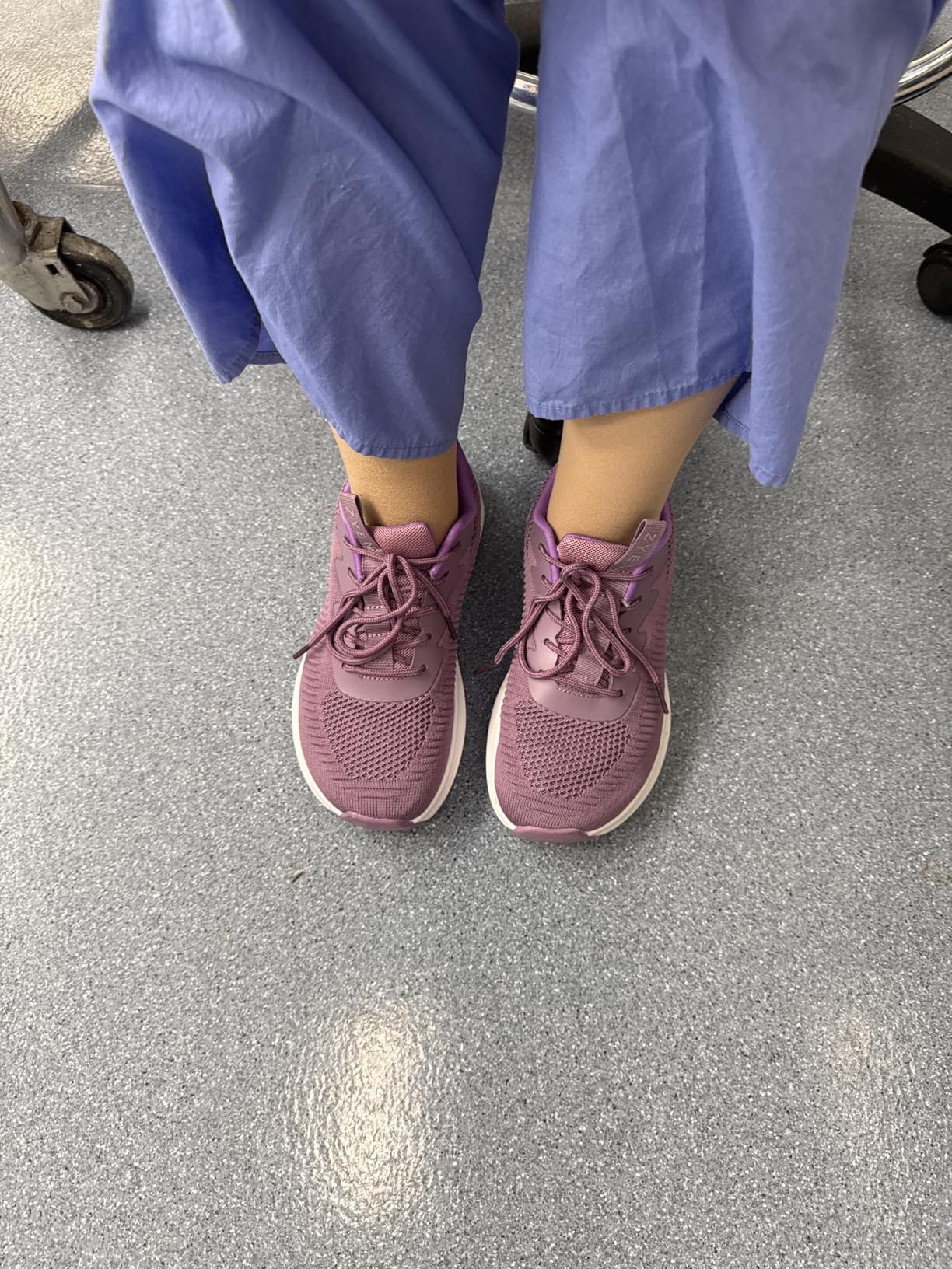 ZYEN shoes being worn on feet showing fit and heel tab detail