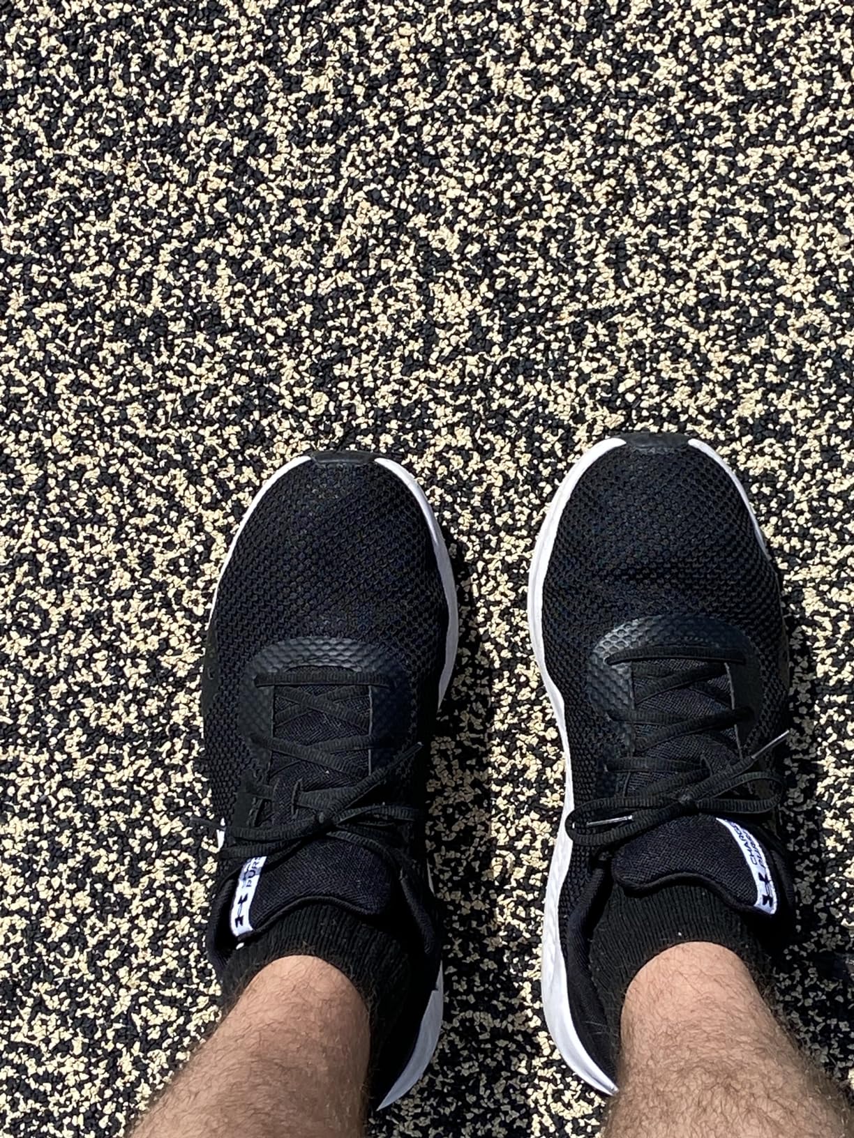 Side profile of Under Armour Charged Pursuit 3 showing 8mm heel-to-toe drop and Charged Cushioning midsole