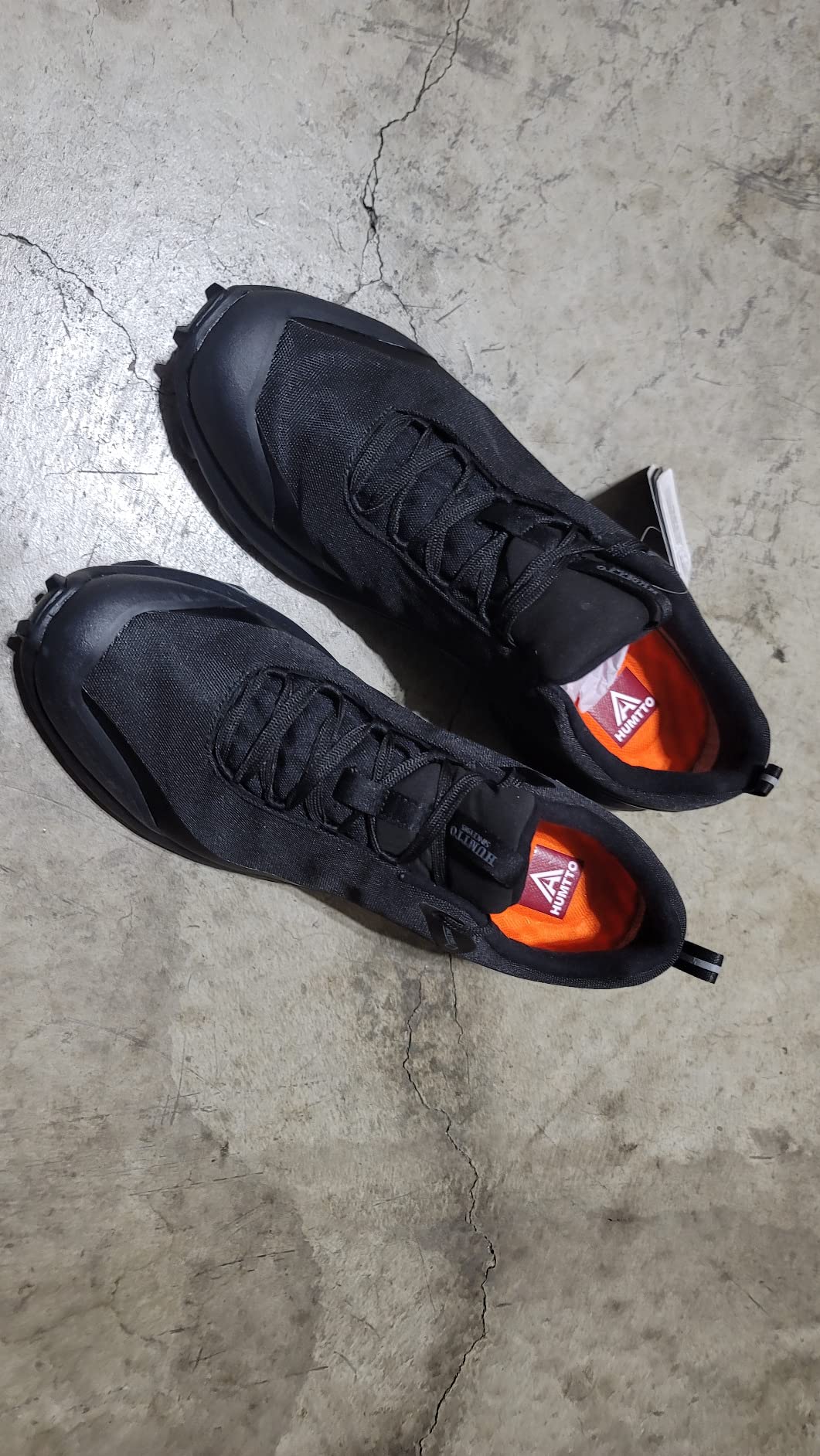 HUMTTO shoe outsole showing aggressive lug pattern and EVA midsole cushioning construction