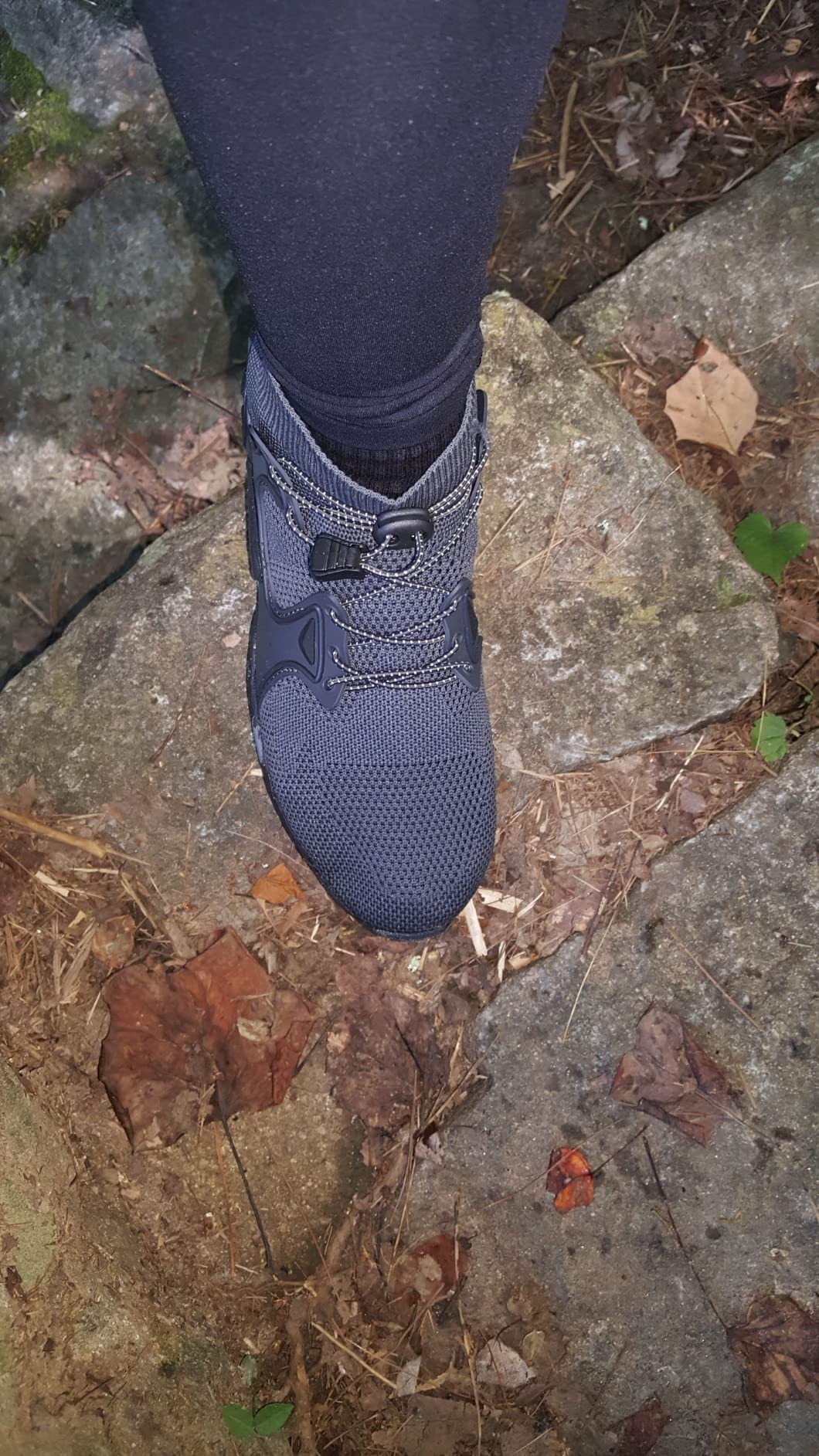 Hiking shoes in natural outdoor environment showing real-world action use on trail