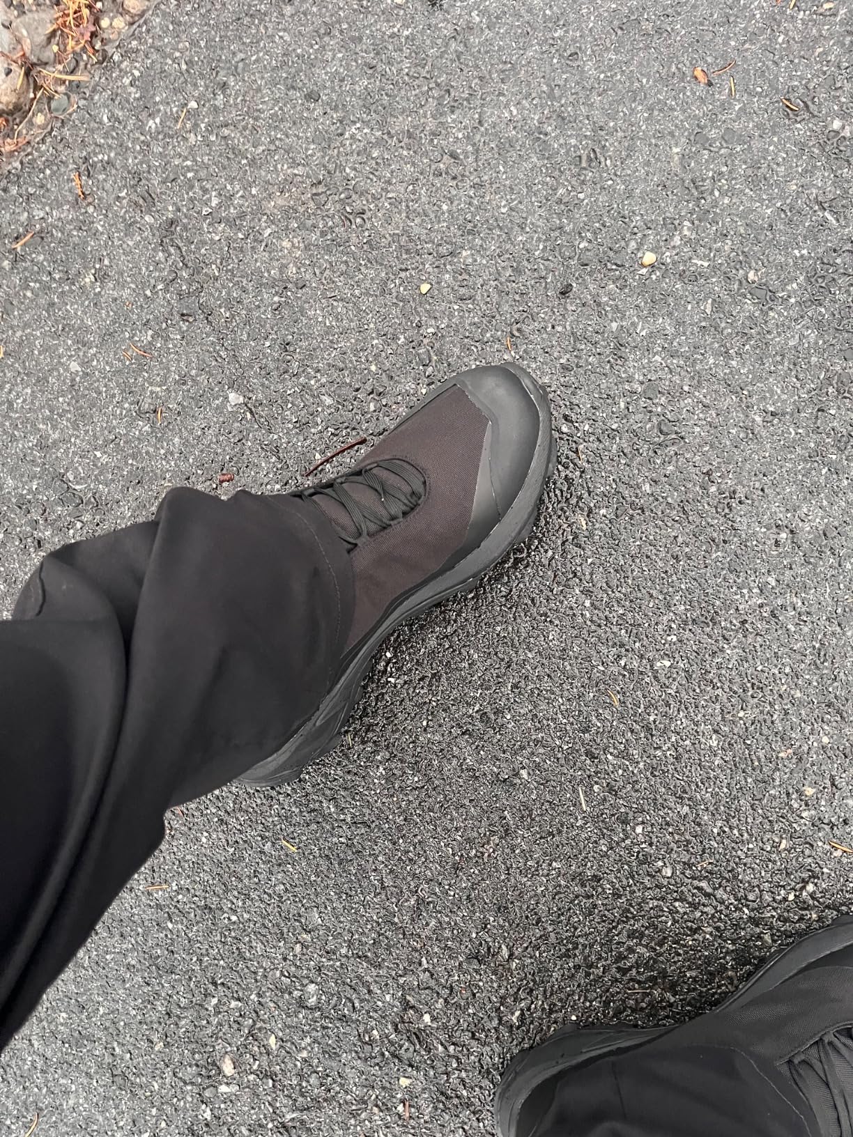 HUMTTO Men's hiking boots in action on rocky terrain demonstrating traction and ankle stability