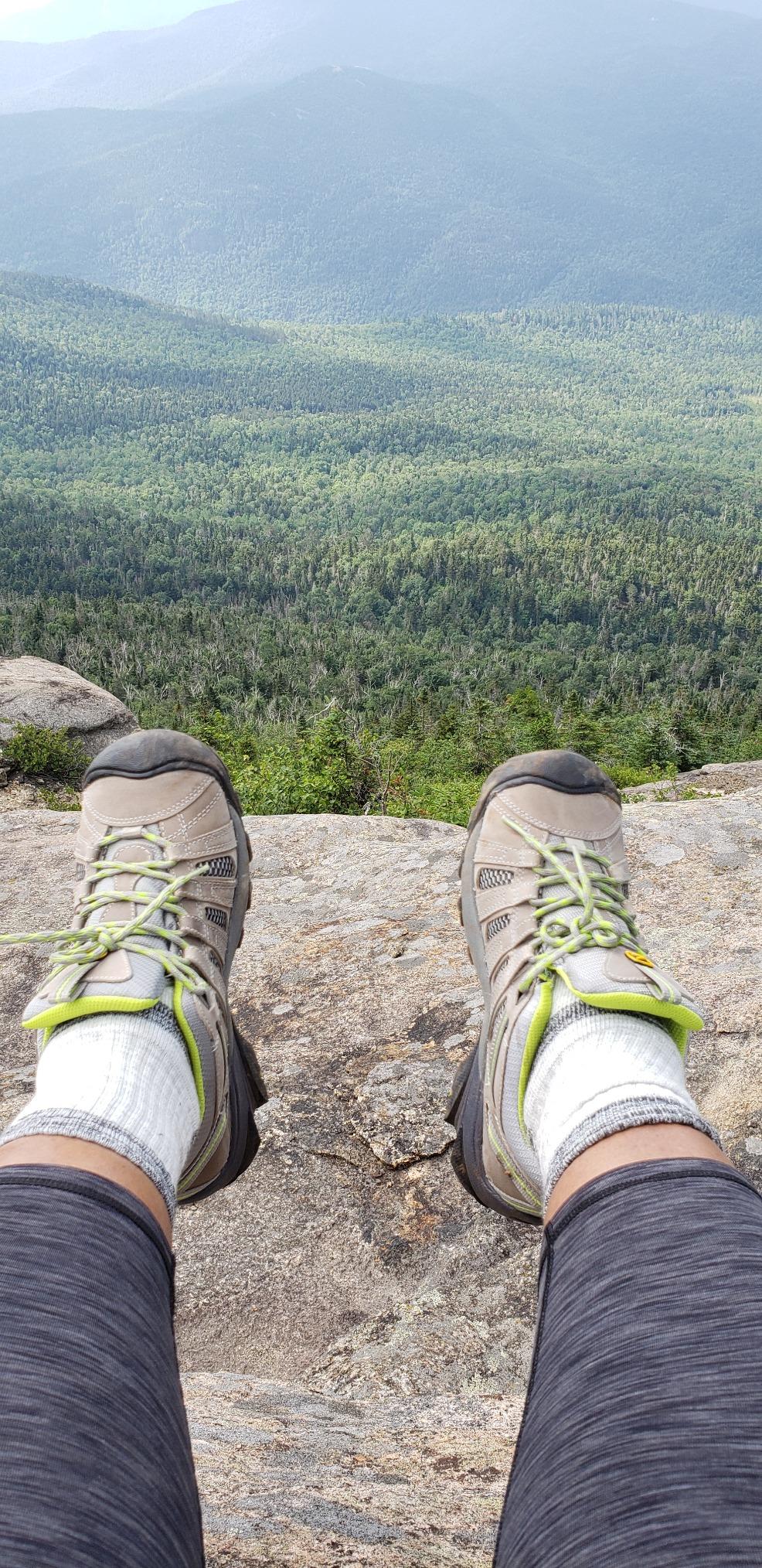 KEEN Voyageur hiking shoe in action on rocky trail showing 4mm lug traction pattern and trail performance