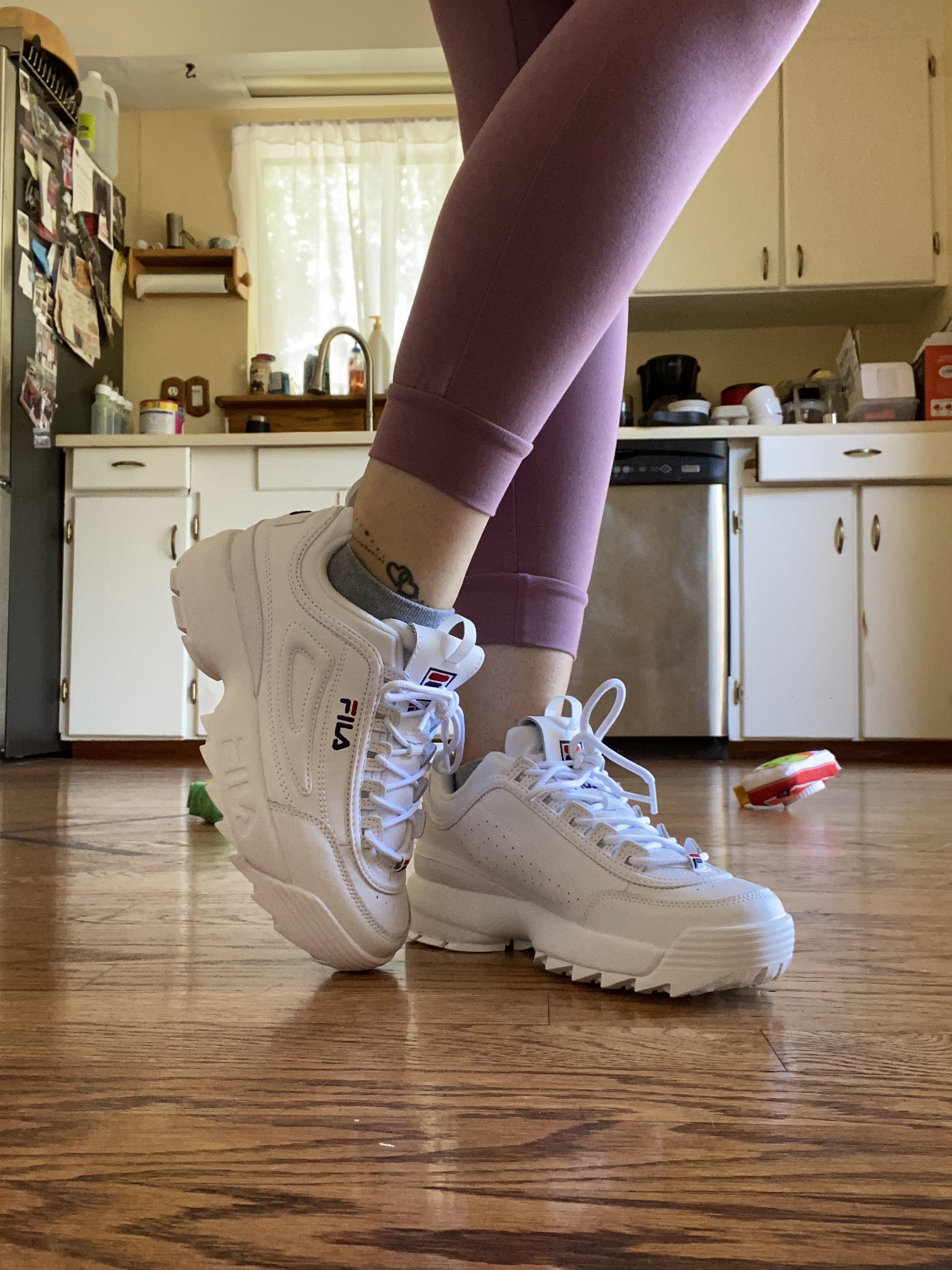 Fila Disruptor II worn during casual daily lifestyle activities