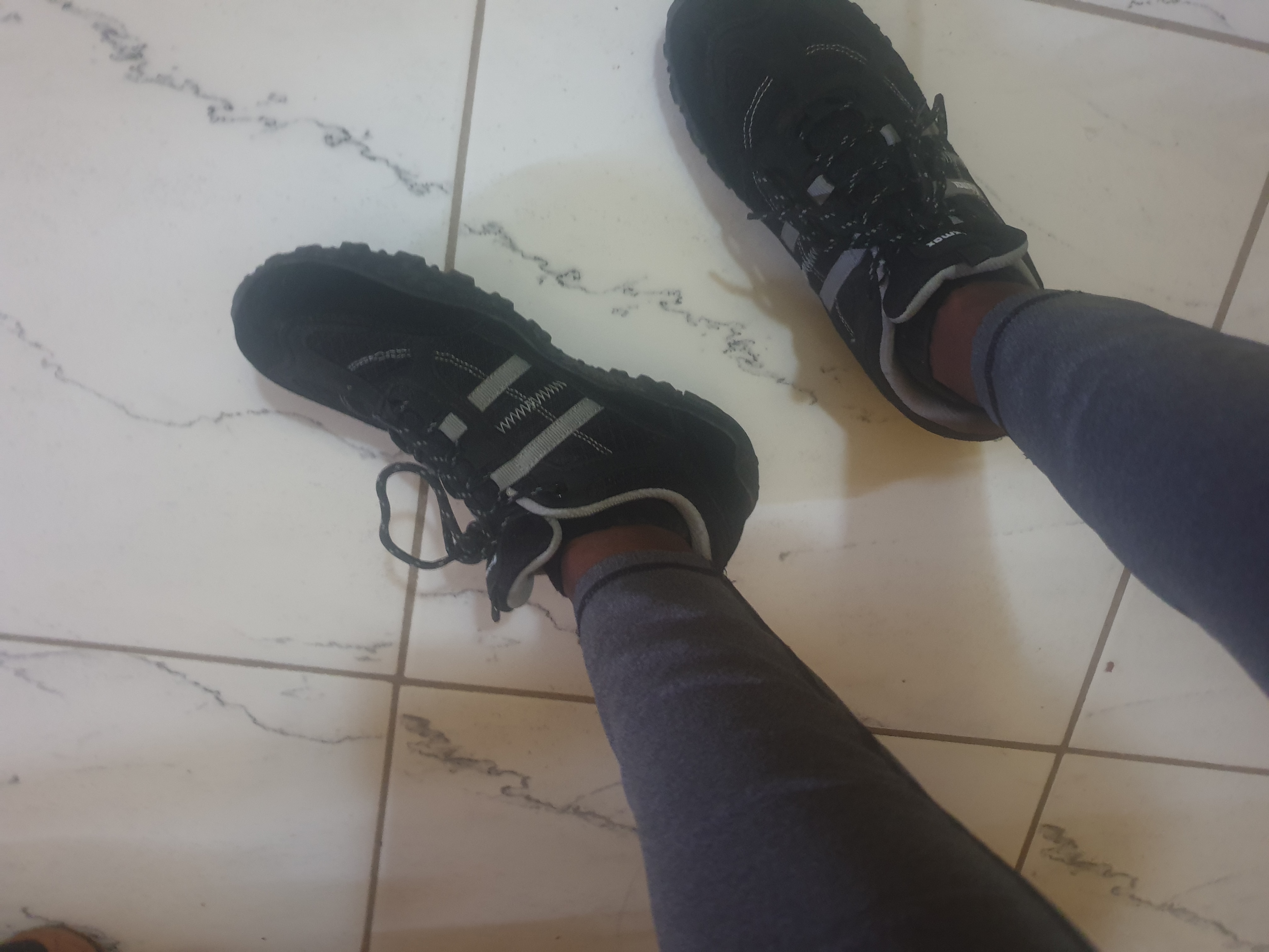 Knixmax hiking shoes navigating rocky trail terrain, demonstrating grip and stability on uneven surfaces