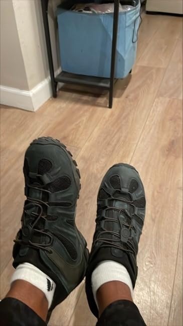 Merrell Men's Chameleon 8 Stretch hiking shoe brown colorway showing elastic lacing system and rugged outdoor construction