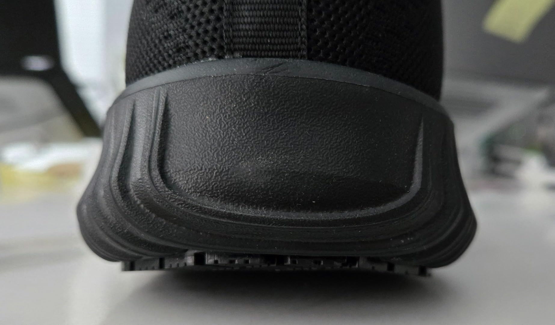 Bruno Marc work shoes outsole showing debris accumulation in tread grooves after shift