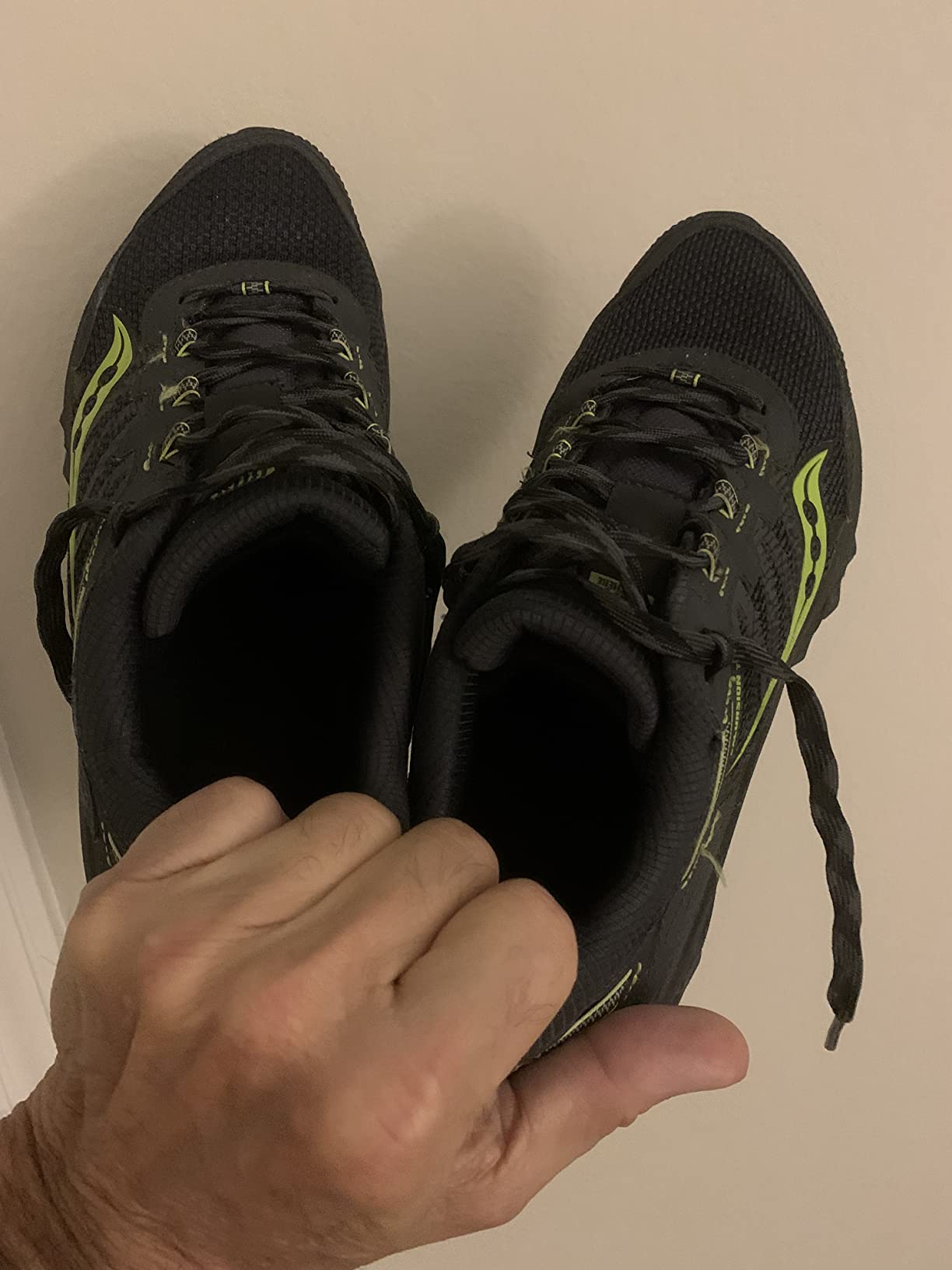 Saucony TR13 shoes shown during real trail use with accumulated dirt and wear