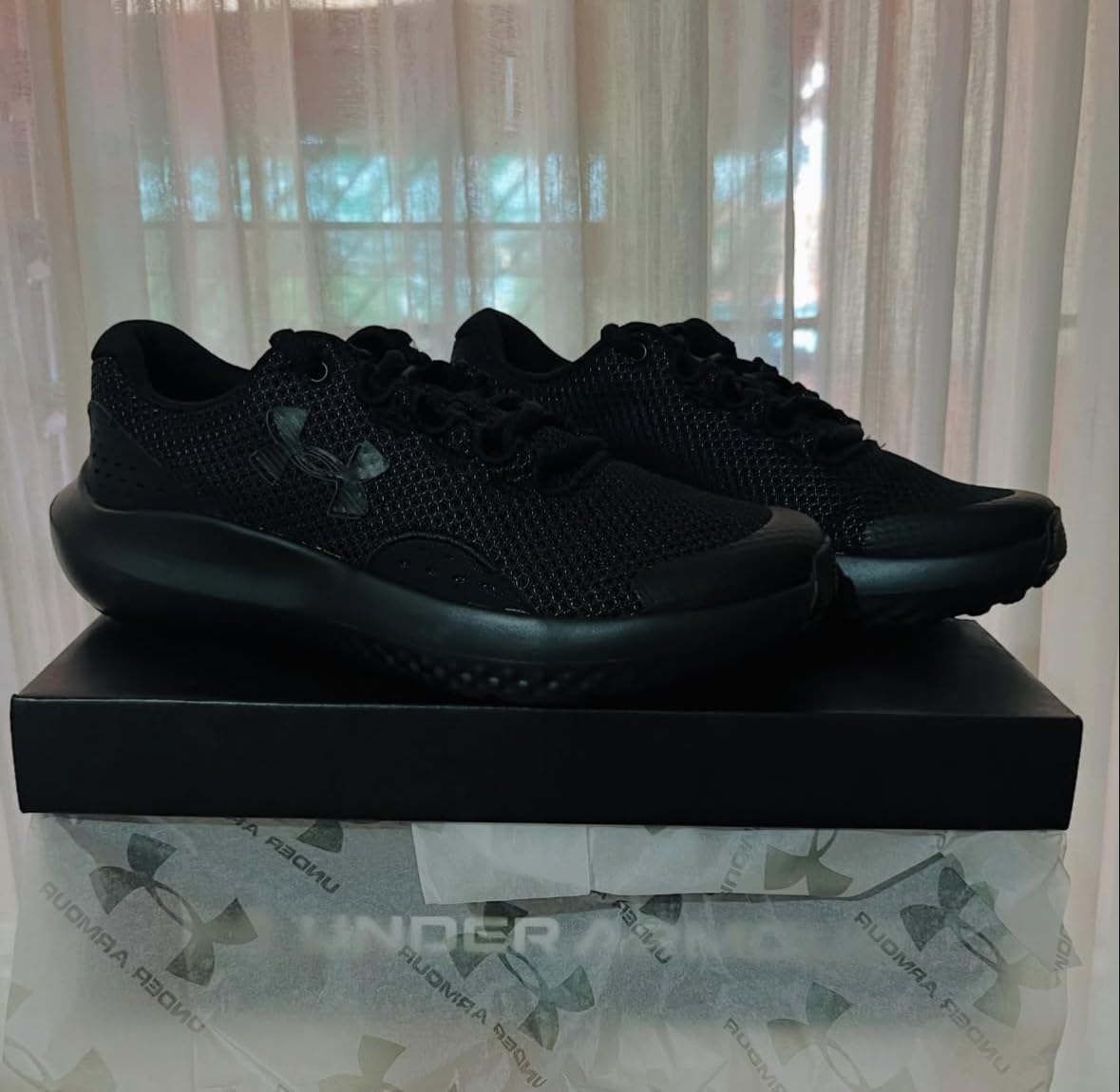 Under Armour Boys Surge 4 mesh upper construction with synthetic overlays detail