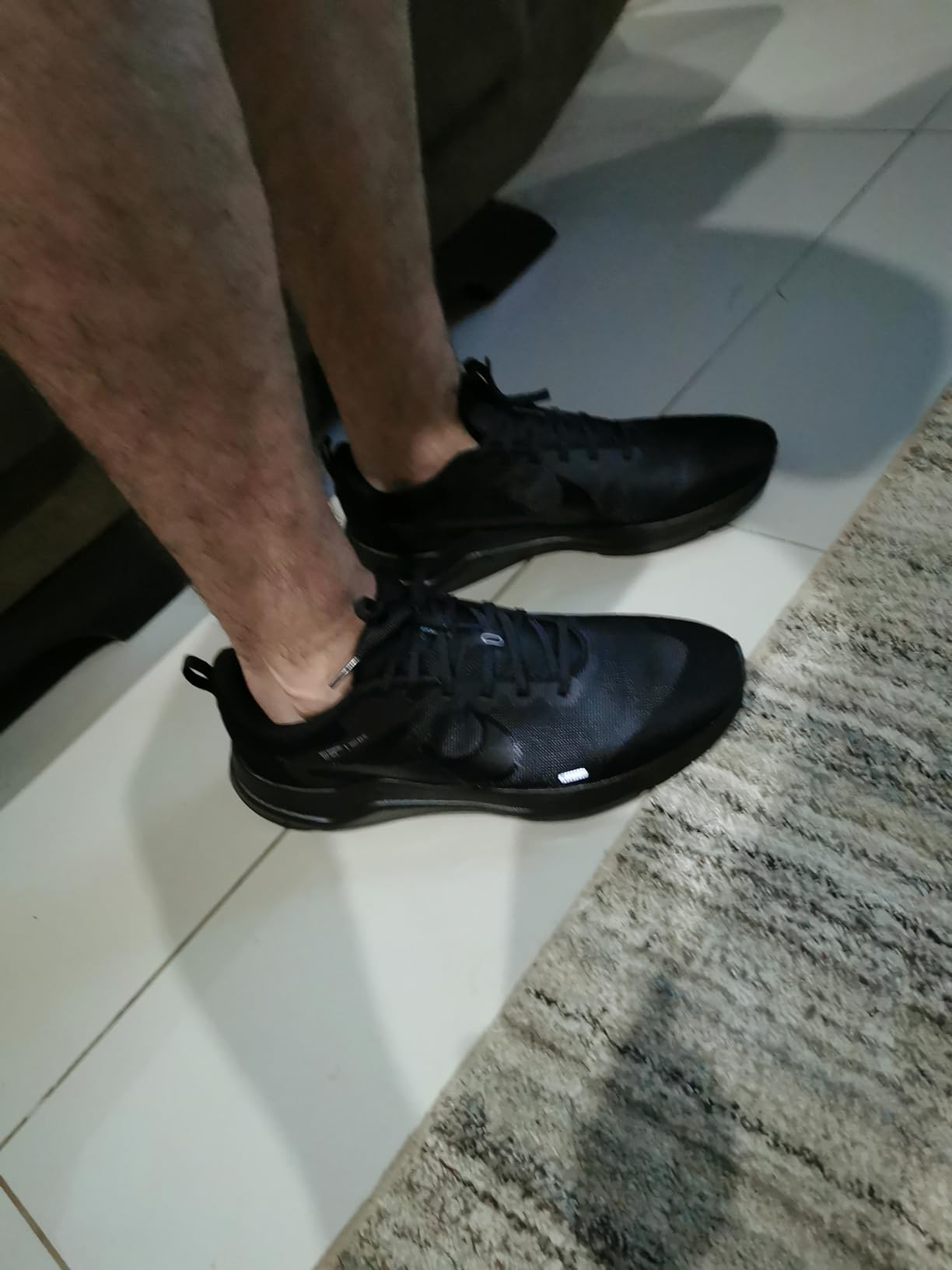 Nike Men's Downshifter 12 final product shot showing complete shoe from multiple angles