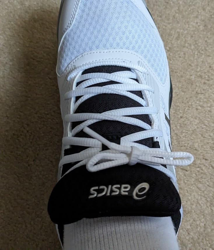 ASICS Upcourt 5 heel counter and toe reinforcement showing construction quality and ankle collar padding