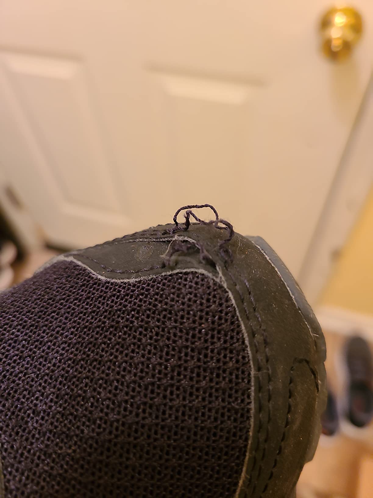 Documented upper tear on Saucony TR14 after approximately one month of wear