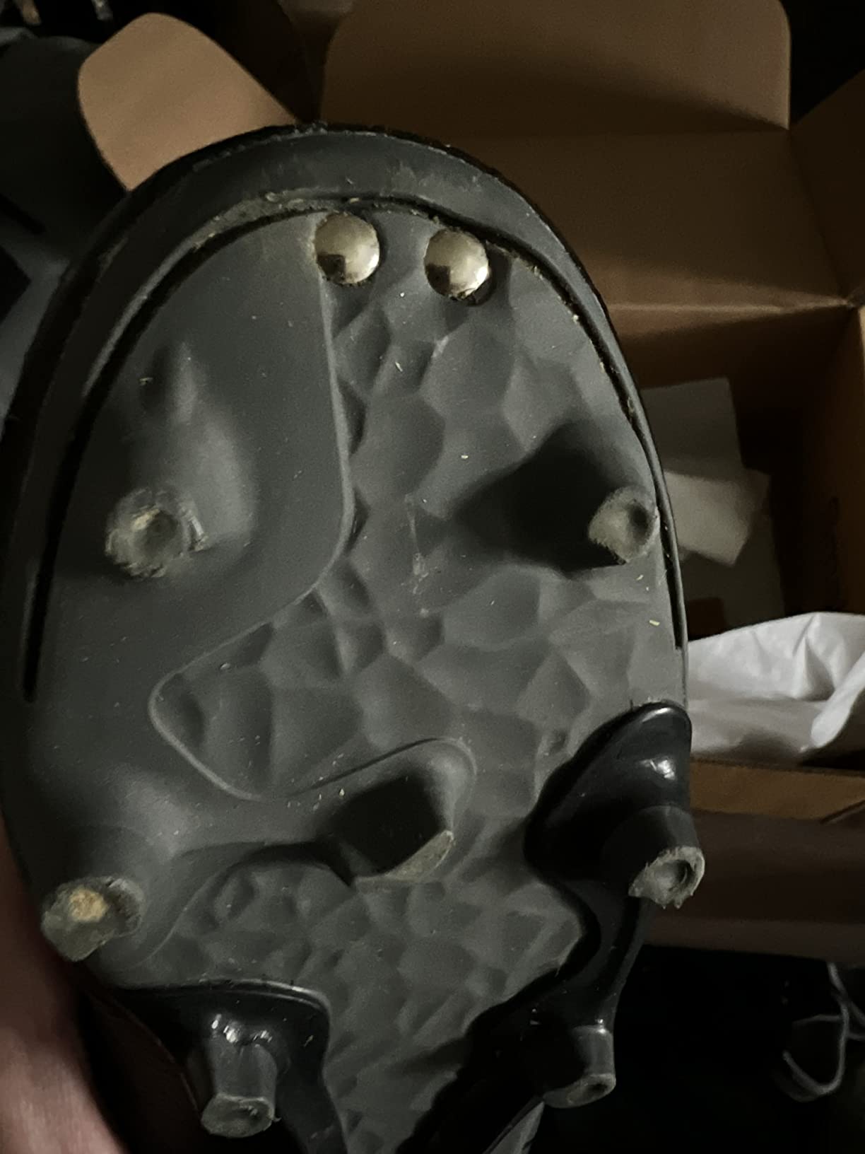 Customer received pair with grass on the studs suggesting prior wear or QC issue