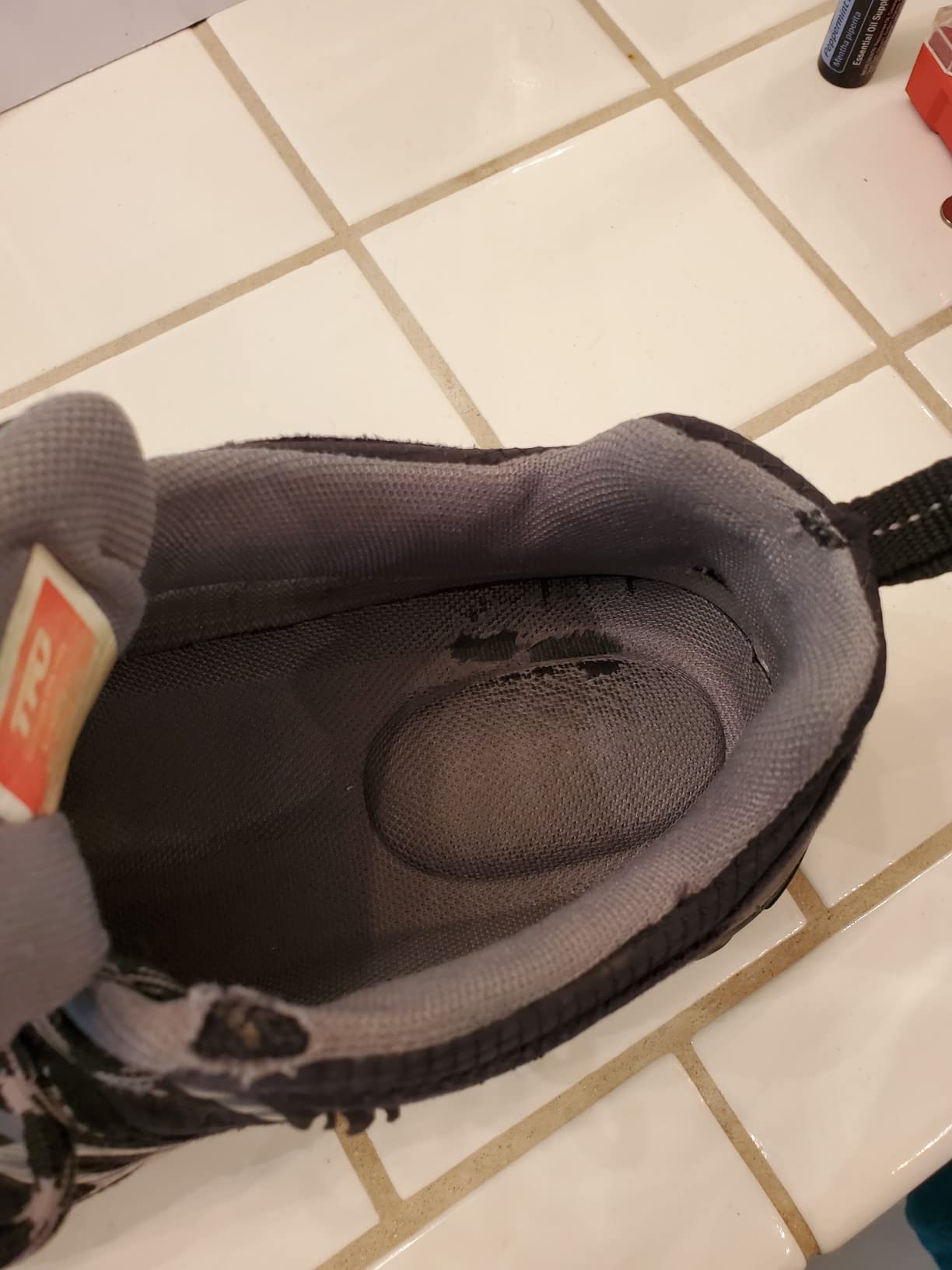 TFO hiking shoes construction detail showing protective toe cap, padded ankle collar, and rubber outsole