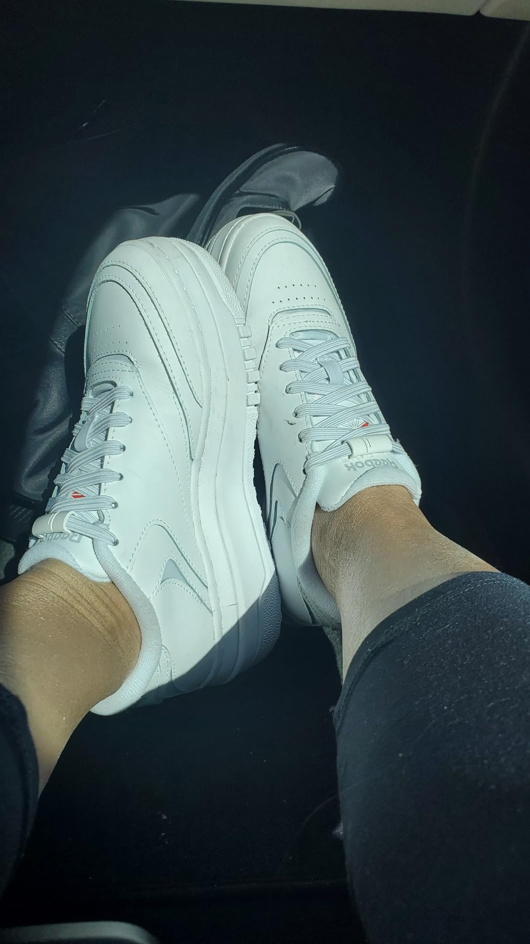 Reebok Club C Extra platform sneakers shown from multiple angles displaying white leather upper and chunky sole