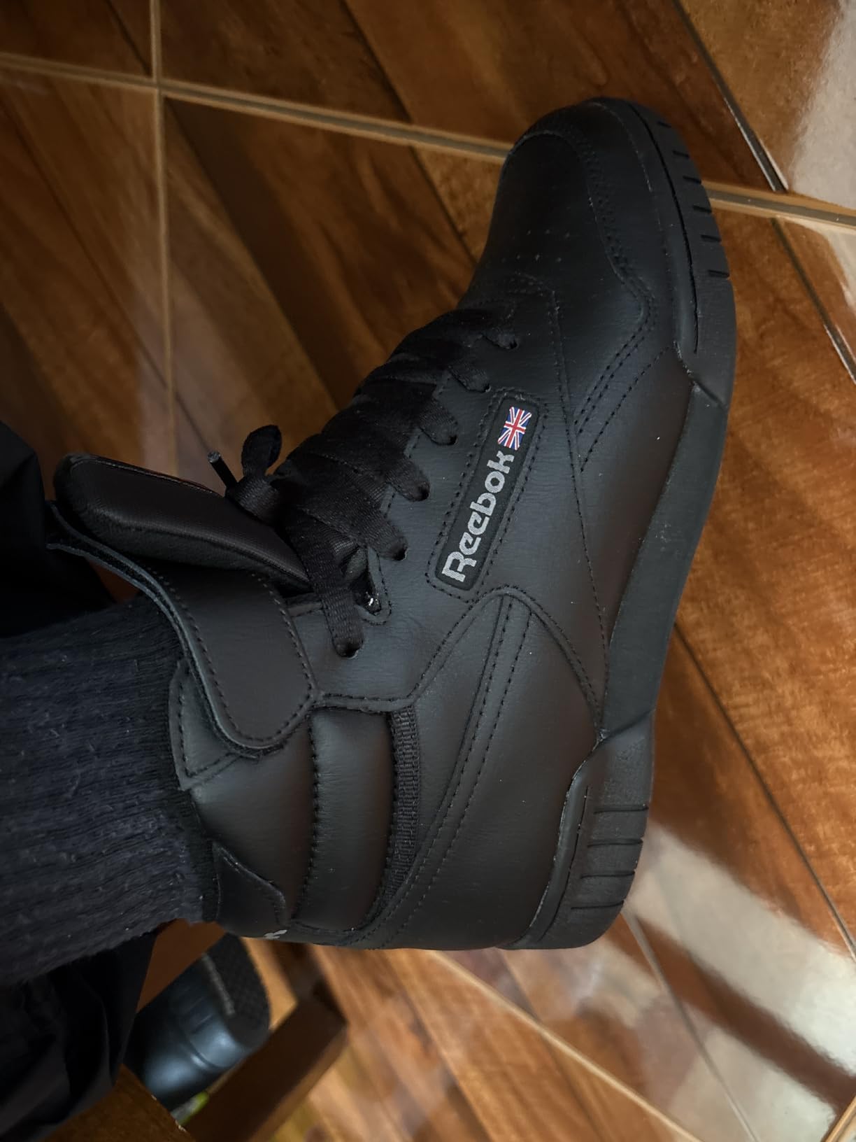 Reebok EX-O-FIT HI white high-top basketball sneakers showing classic 80s retro design with full-grain leather upper