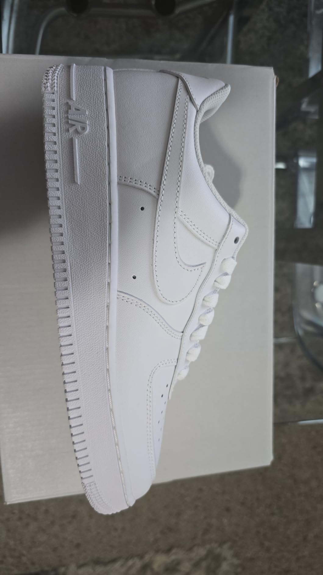 Nike Air Force 1 '07 side profile view showing ankle collar height and classic basketball shoe silhouette