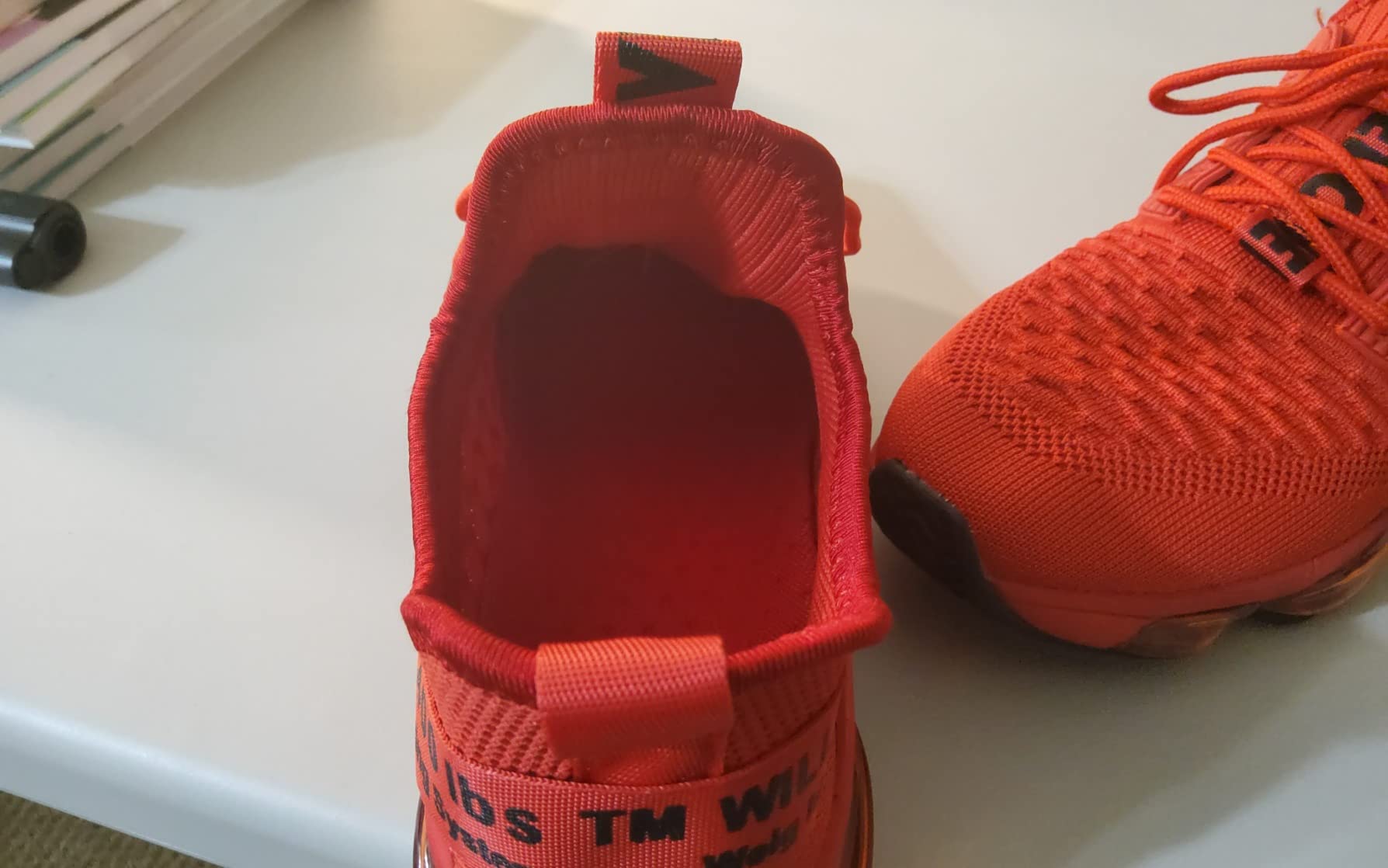 Bottom view showing rubber traction pattern and air cushion design details