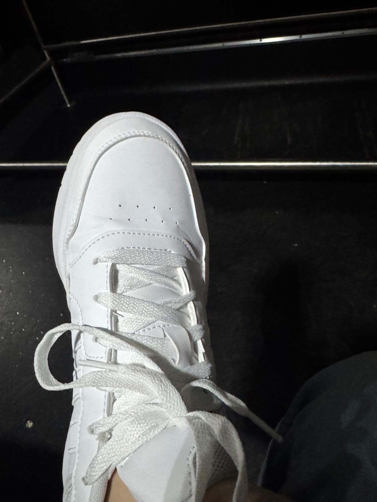Side profile of Adidas Hoops 3.0 showing mid-cut ankle design and overall silhouette