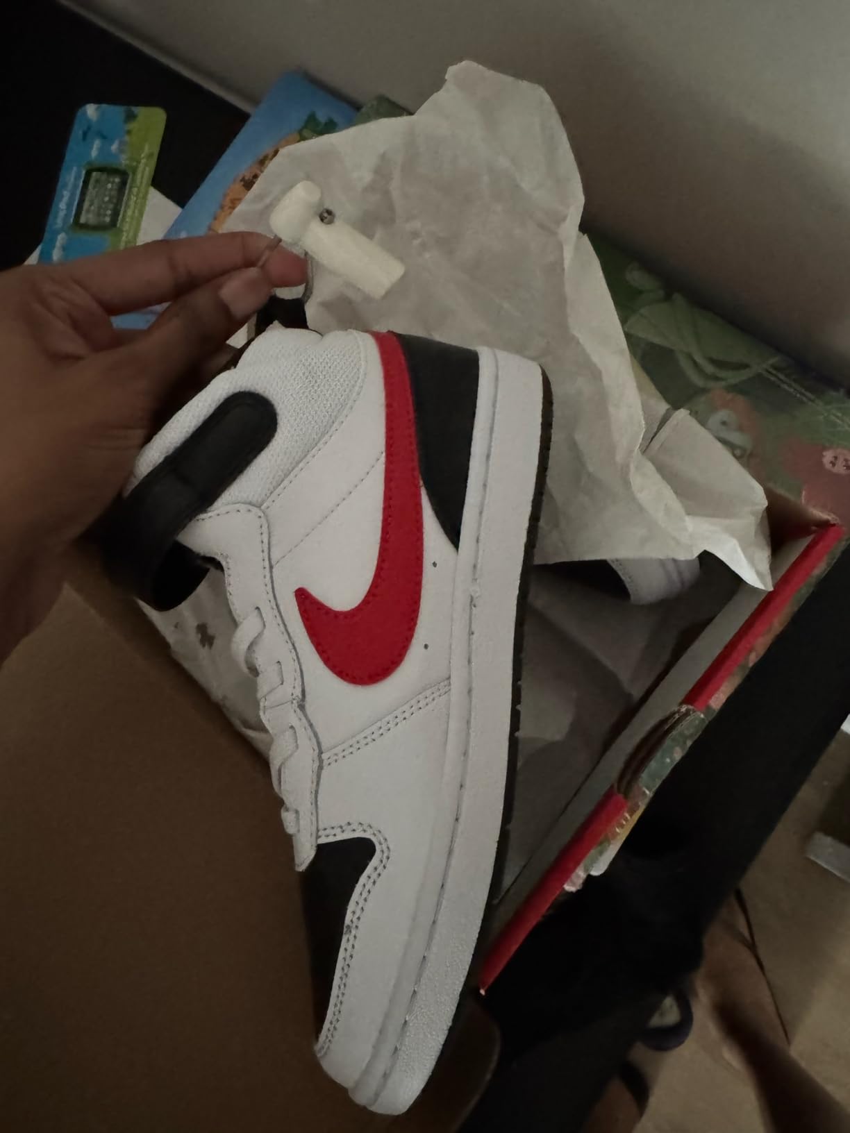 Nike Court Borough Mid 2 hook and loop Velcro strap closeup showing adjustment mechanism